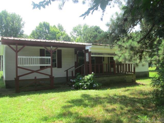 One story manufactured home with detached carport. There bedrooms and two baths with split floor plan. Located on large lot with lots of shade trees offers privacy. Call today for details.