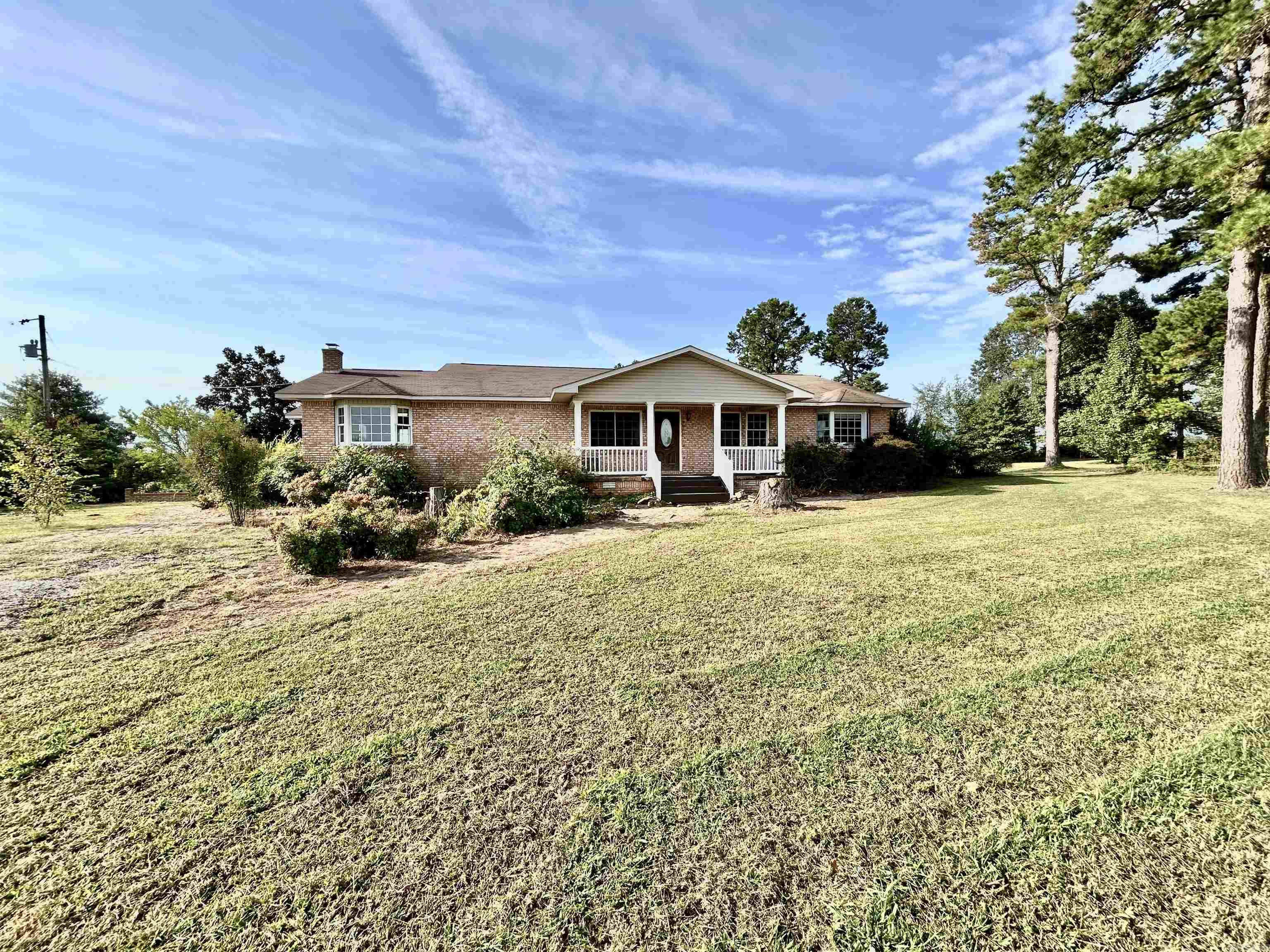 Beautiful 4 bedroom, 2 bath home in the country, with 2.5 private acres that has gorgeous views in all directions. This home has a lot of character, from the windows to the arch ways and the Dutch doors leading into the office from the foyer! Living room has a wood burning stove, bay window seat and slider that gives plenty of natural light to this spacious room! Large kitchen with dining area and breakfast bar, plus a formal dining room. Laundry room has plenty of space for a freezer and more storage if needed, with a separate mud room off the back porch. Home has a basement and a safe room. There is a 30x40 shop with concrete floors. There is a front and back porch with a nice deck to enjoy all the professional landscaping, a huge garden area and room for a horse, no restrictions on this land, you can do whatever your heart desires! Call for a showing today!