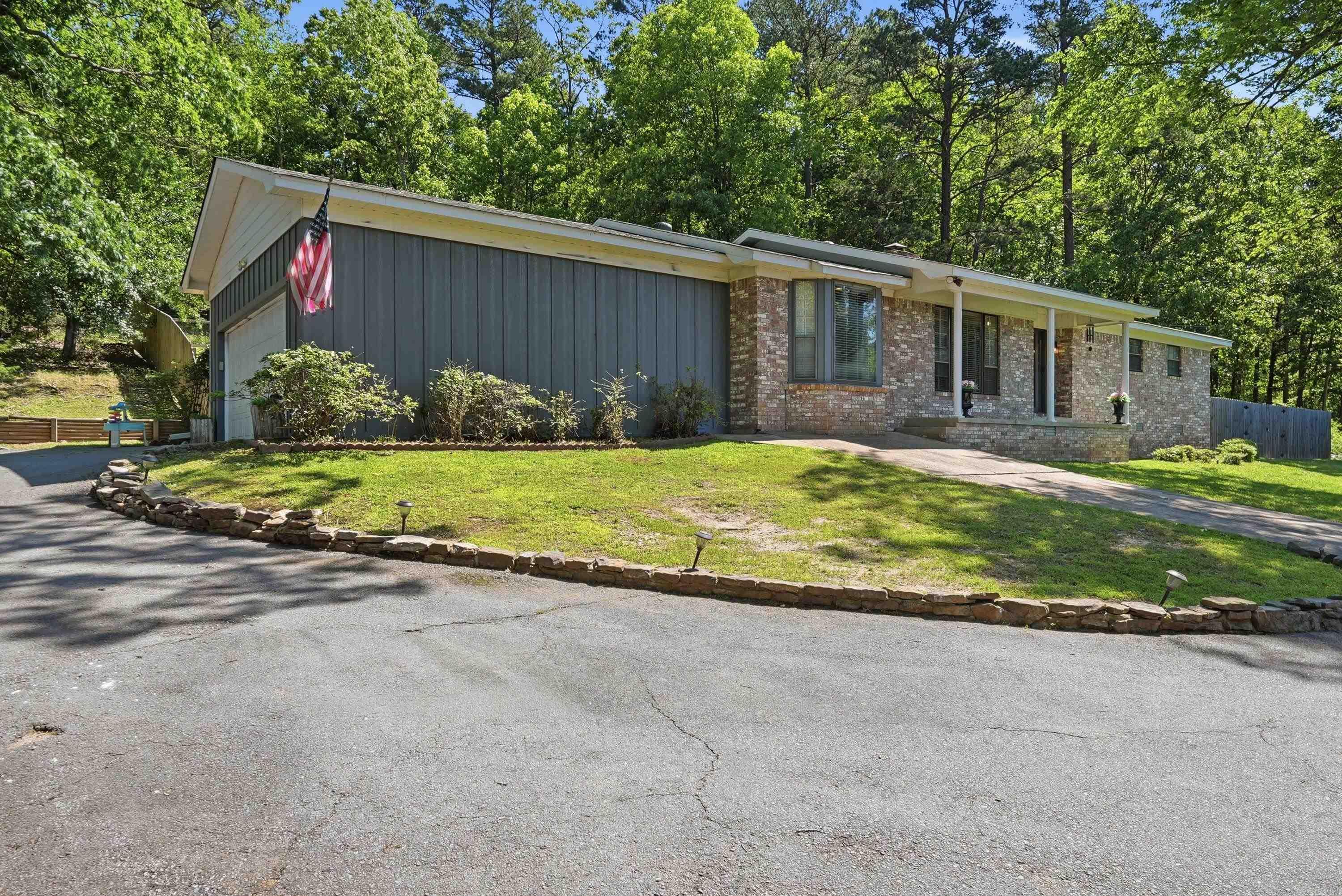 Move-in ready!!! New roof, May 2026! Washer & dryer, refrigerator & microwave all convey! One-level living on 4.18 acres with the perfect balance of space, comfort, and convenience. Located just outside the city limits, this property offers the feel of peaceful living while still being just minutes from Little Rock amenities, shopping, dining, and interstate access.  Inside, the open floor plan and two separate living areas create an inviting setup for hosting friends and family with plenty of room for everyone to spread out and relax.  The property also features a 2-car garage, fenced backyard, add’l detached garage, and a second access point to the adjoining land adding even more flexibility and functionality. With usable acreage, multiple gathering spaces, and room both inside and out, this is a great place to call home!  Lots of Col Glenn road frontage- the adjacent land can be accessed from the homesite and it has its own separate entrance with small shed and power supply onsite.