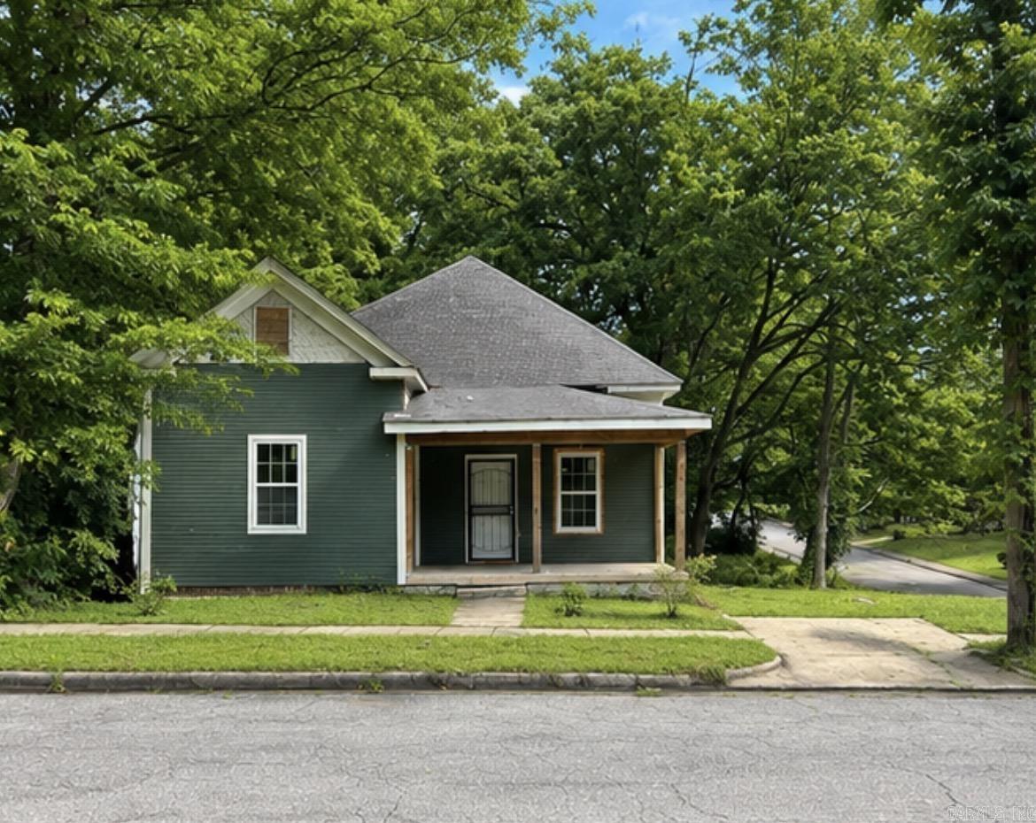 Investor Special in the Heart of SoMa/Pettaway District! Located just minutes from downtown Little Rock with quick access to I-630 and I-30, this 3-bedroom, 2-bath home offers 1,612 square feet and a tremendous opportunity to complete a major renovation project. Significant improvements have already been completed, including structural updates, foundation improvements, major system upgrades, new windows, and extensive renovation work throughout the property. A new condenser will also convey with the sale. Additional materials included are upstairs windows not yet installed and custom-made wood siding matching the front exterior.  Remaining work includes installation of a stair railing, finishing the upstairs space, and construction of a deck that will also provide support for the upstairs area prior to framing inspection. Excellent opportunity for investors, builders, or renovators looking to add value in one of Little Rock’s most desirable and rapidly growing neighborhoods. Sold as-is.
