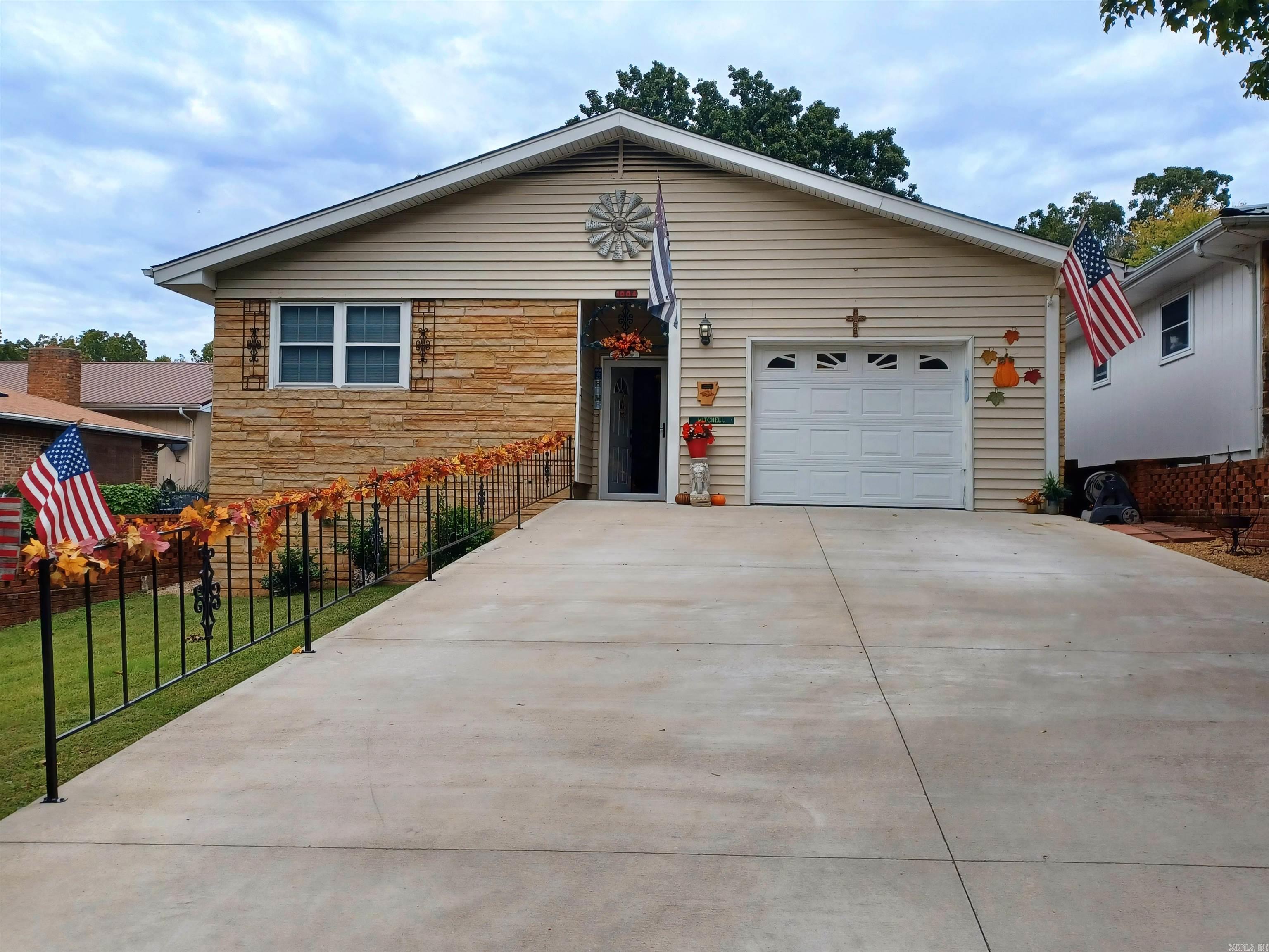 If living in a carefree home is what you're looking for then this beautiful 2-bedroom 2 bath (master bath has a step-in shower), with a sunroom home is for you. This is a 55 and older neighborhood. This home has been beautifully maintained. Newer vinyl tile flooring. The stone fireplace is gas log. The propane tank conveys with the home. There's a hutch in the living room that has lights in it to show of your trinkets. Nice bright kitchen with white cabinetry and beautiful marble like laminate countertops.  Lighting under the cabinets to light up the counter tops. Ceiling fans thru out the home. Electric attic fan. Recessed lighting. Huge laundry room has sensor lighting in it. Lots of storage space. New roof was put on in 2022. The 2-car concrete driveway was poured in 2021. New decks on each side of the back of the home to sit and enjoy the park. There is a HOA fee, but it includes lawn service. This home is beautiful. Call today to see it.