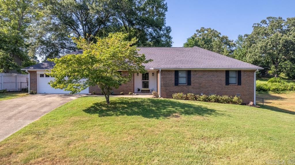 COMPLETELY REMODELED! This all brick beauty has been transformed into a bright and airy, modern home. New floors, paint and fixtures throughout! Updated kitchen and baths with granite! The eat in kitchen opens into the sunroom overlooking a fully fenced backyard. The formal dining room is perfect for your large family gatherings. The living room is inviting and features a fireplace. The master bedroom features an upscale bathroom and large walk in closet. Huge laundry room with tons of storage. Move in ready with a 2 car garage and under house storage and a whole home GENERATOR that runs on propane. You'll never be left in the dark. This one won't last long!