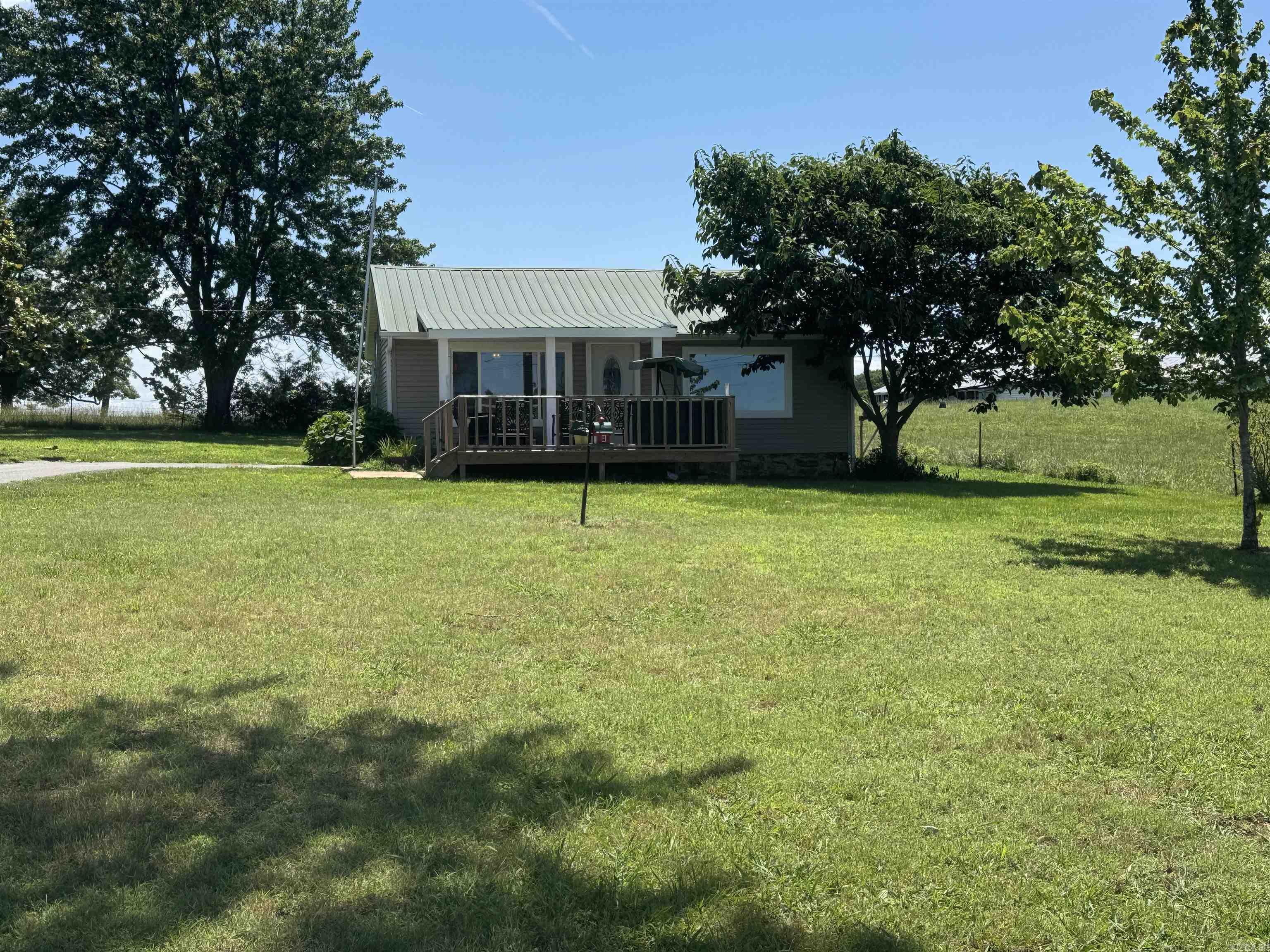 Great little home in the country. Updated  luxury vinyl floors and stainless appliances. AC unit around 9 years old. Generator 4 years old. New Septic system and field lines 2026.  Has a nice large shop with electric and RV hookup. Nice yard with paved driveway.  Garden spot already established.  Would make good full time for couple or rental property. Hill Creek Marina and boat launch 10 mins away.  Drive by and Give us a call today.