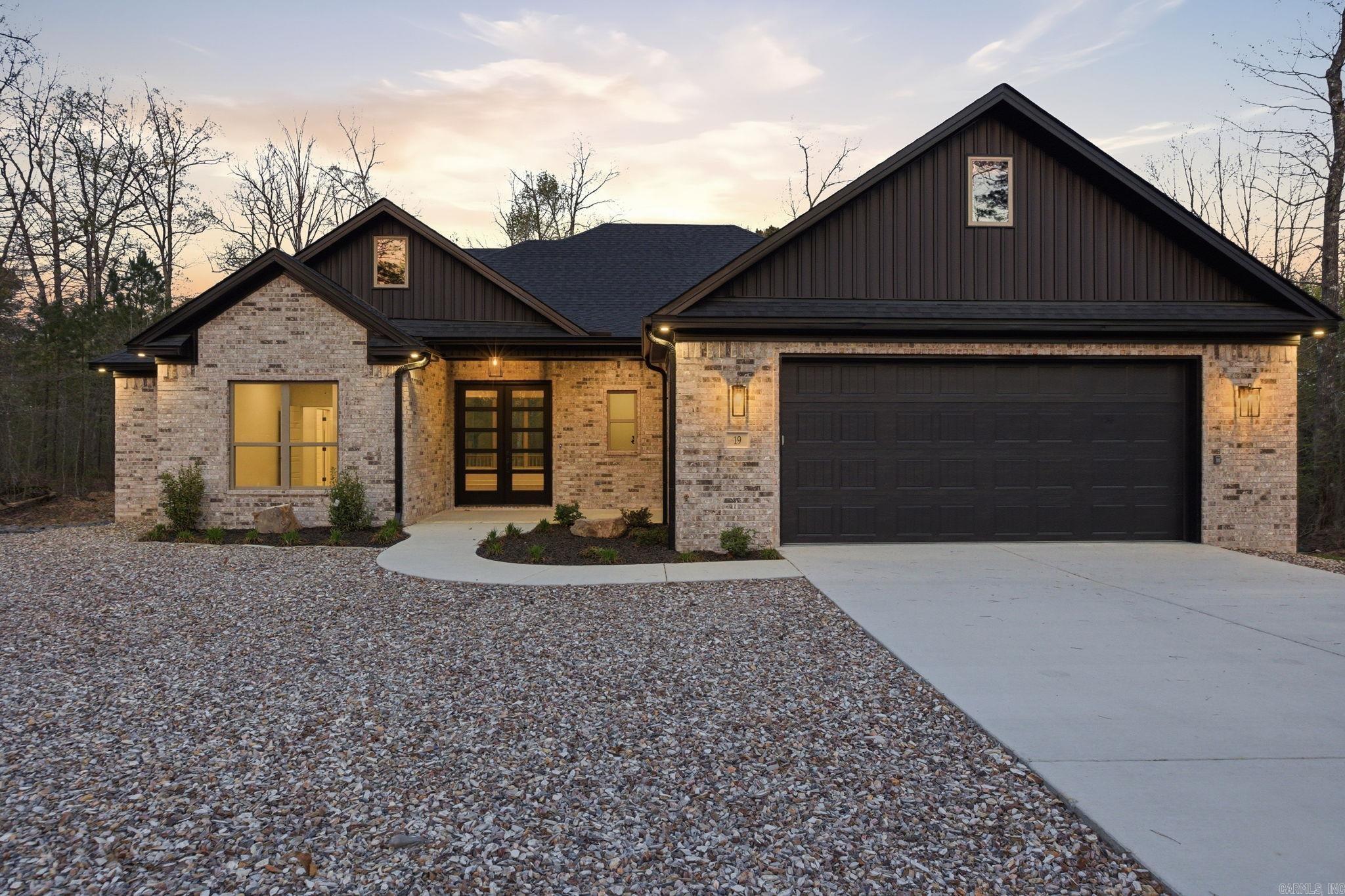 Clean lines. Smart design. Zero wasted space. This beautifully crafted modern home delivers the layout buyers actually want—3 bedrooms, 2 bathrooms, and a seamless flow that feels both open and intentional. The kitchen is the centerpiece, anchored by a spacious walk-in pantry that keeps everything tucked away while the main living areas stay sleek and uncluttered. Just off the garage, a well-designed drop zone makes everyday living effortless—bags, shoes, and life stay organized the moment you walk in. The split-bedroom floor plan offers privacy where it matters most, while the primary suite provides a quiet retreat at the end of the day. Out back, a covered deck extends your living space year-round—perfect for morning coffee, evening unwinding, or hosting without the heat. All of it set on a quiet street in Hot Springs Village, where peaceful surroundings meet an active lifestyle. Modern. Functional. Exactly what today’s buyer wants!