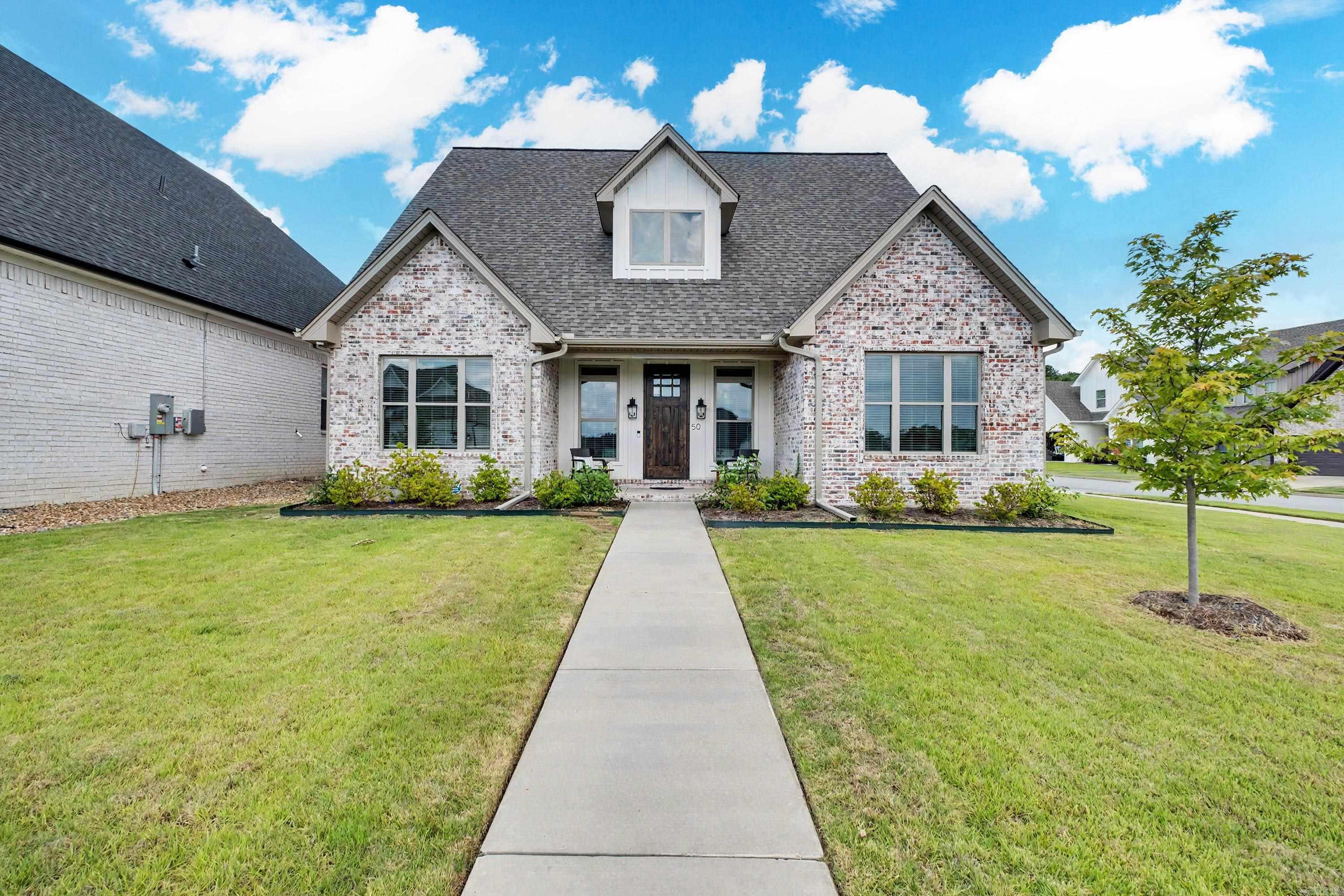 Beautifully designed home on a corner lot with a side-entry garage and a spacious fenced backyard. The open-concept living area features a cozy fireplace and creates an inviting space that's perfect for everyday living and entertaining. The kitchen offers quartz countertops, ample workspace, and modern finishes while remaining connected to the main living area. The private primary suite features a vaulted ceiling with an exposed beam, large windows that fill the room with natural light, and an en suite bath with direct access to the walk-in closet and laundry room for added convenience. Upstairs, you'll find two additional bedrooms, a full bath, and a versatile bonus room perfect for a playroom, media room, home office, or guest space. Thoughtfully designed with stylish finishes and a functional layout, this home is ready for its next owner.