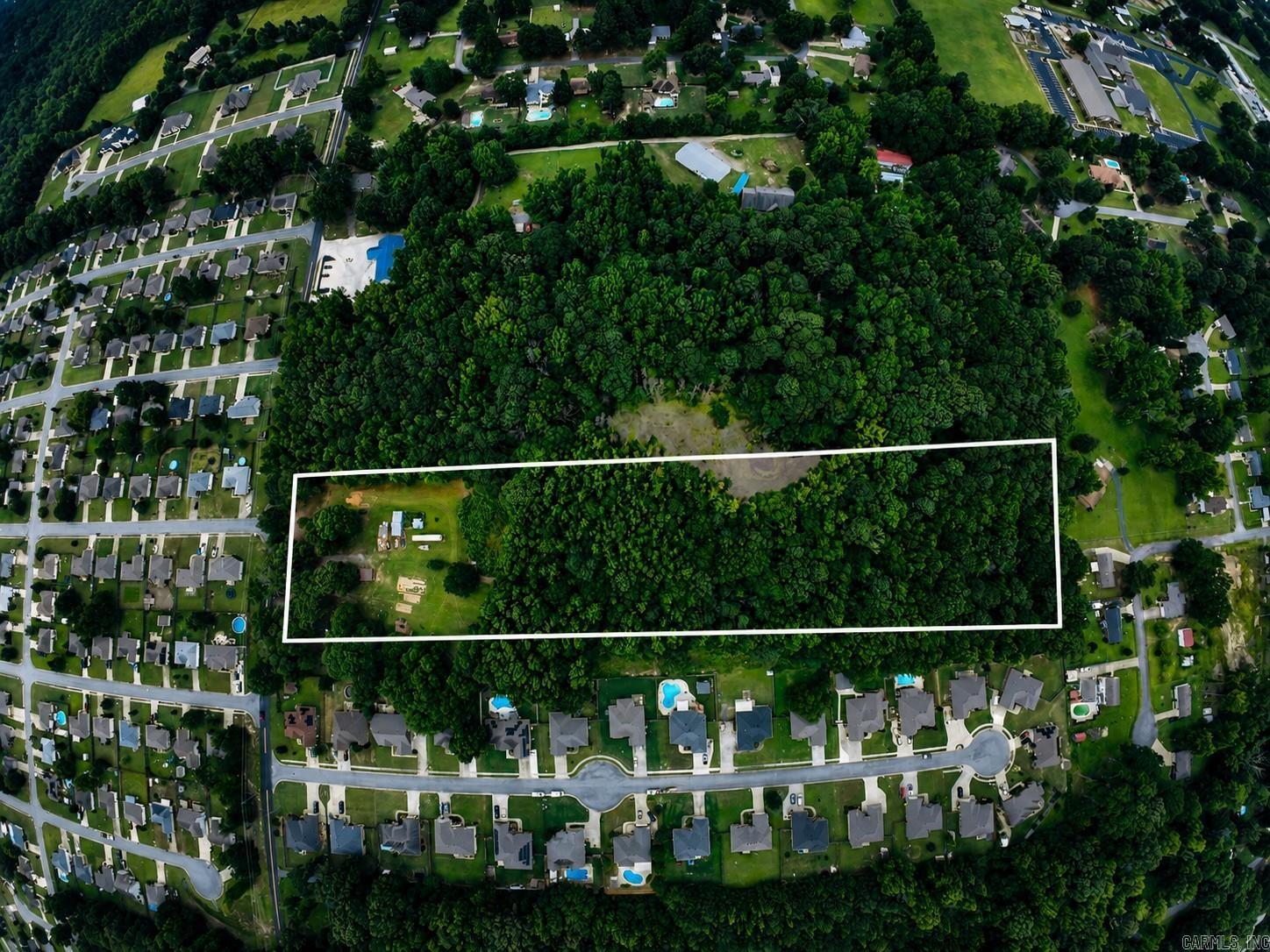 RARE CABOT OPPORTUNITY! Nearly 9 acres in the heart of Cabot surrounded by established subdivisions—an incredibly unique property with endless potential! Whether you're looking for a private family estate, multi-generational living, investment property, or future development possibilities, this one checks all the boxes.  The property features two homes, offering flexibility for extended family, rental income, or guest accommodations. Enjoy the privacy and space of country living while being just minutes from schools, shopping, and restaurants.  Properties of this size and location rarely become available. With acreage inside the city surrounded by residential development, the possibilities are truly exceptional.