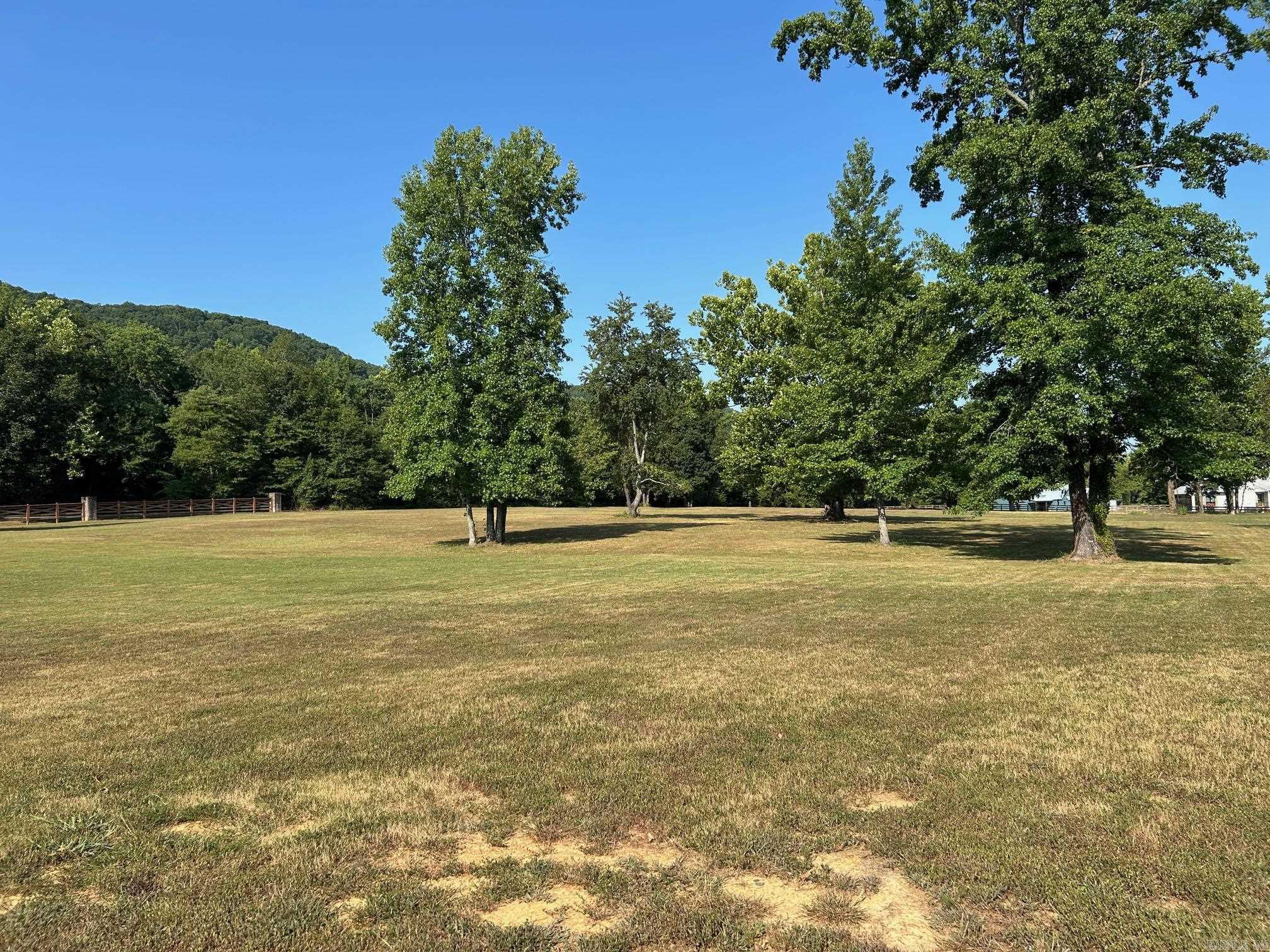 **Premier Lot in Rivers Edge Subdivision** Discover the finest vacant lot in Cleburne County, a rare gem in the prestigious Rivers Edge Subdivision. Close proximity to the Little Red River, this exquisite lot offers unrivaled luxury and natural beauty, perfect for your dream home. Backing up to a lush green area, it ensures privacy and stunning views of Libby Bluff with the soothing sounds of the river just steps away. The subdivision is adjacent to a public launch ramp at Lobo, enjoy world-class fishing and boating on the pristine Little Red River. Rivers Edge redefines upscale living with gated entry for security and exclusivity. Savor premium amenities: a community boat dock for waterfront adventures, a sparkling pool for relaxation, a charming pond, & a clubhouse for gatherings. Utilities—water, high-speed internet, and electric—are conveniently at the road, ready for your custom build.   This lot is more than land; it’s a lifestyle of elegance and adventure. With its prime location, unmatched amenities, and serene riverside setting, it stands alone as Cleburne County’s most coveted property. Seize this opportunity to create your legacy in a paradise of luxury & tranquility.