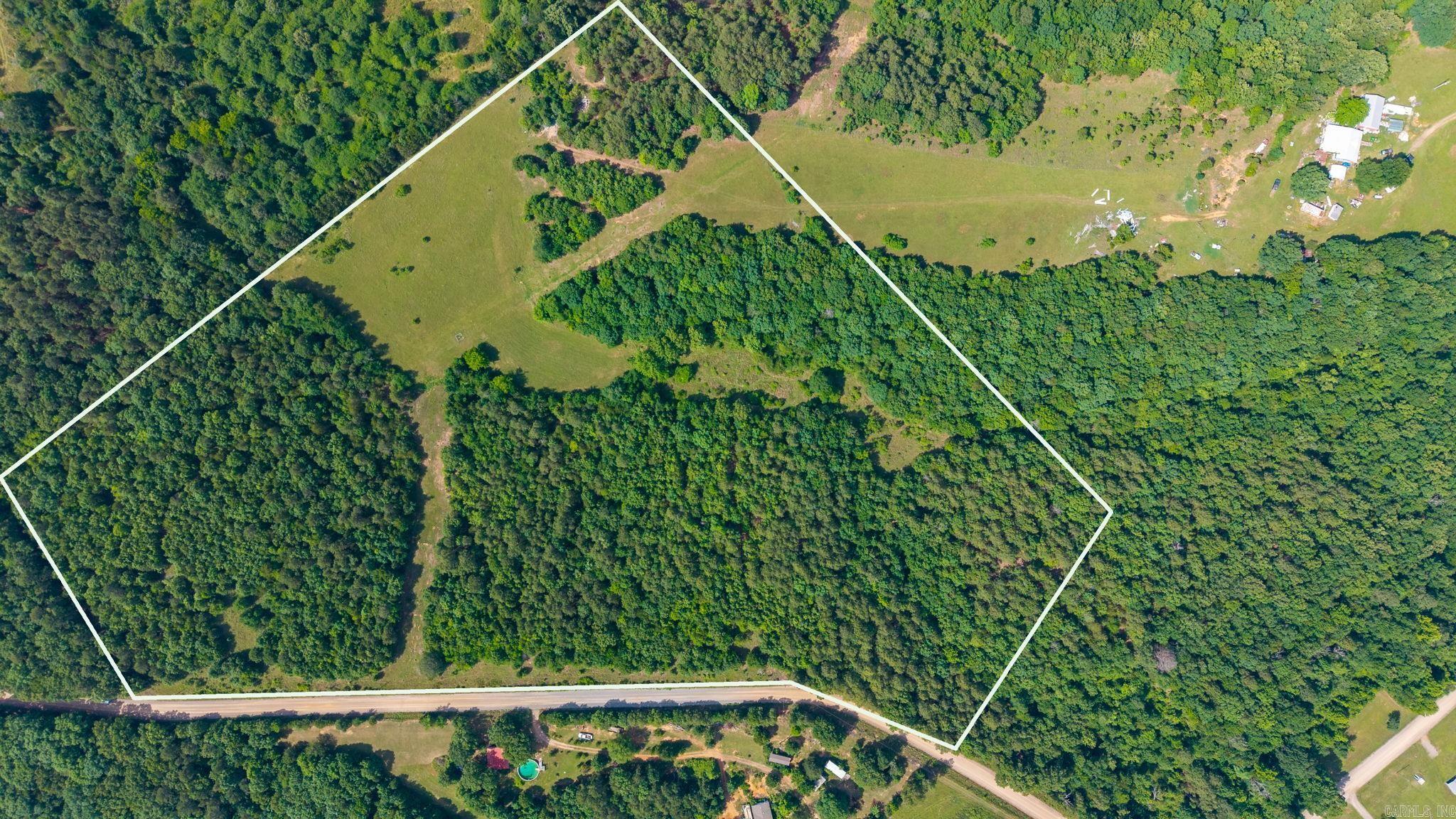 Discover the serene beauty of your future home site with this expansive 29.65-acre property, offering a perfect blend of privacy and natural charm. Nestled in a lush, wooded setting, this land provides a tranquil escape from the hustle and bustle of everyday life. Imagine waking up to the gentle rustle of leaves and the melodic birdsong that fill the air. With ample space to design your dream home, you can create a personal oasis tailored to your desires. Whether you envision a rustic cabin, a modern retreat, or a sprawling estate, the possibilities are endless. Embrace the opportunity to explore nature’s wonders right in your backyard, with plenty of room for hiking trails, gardens, or a peaceful pond.