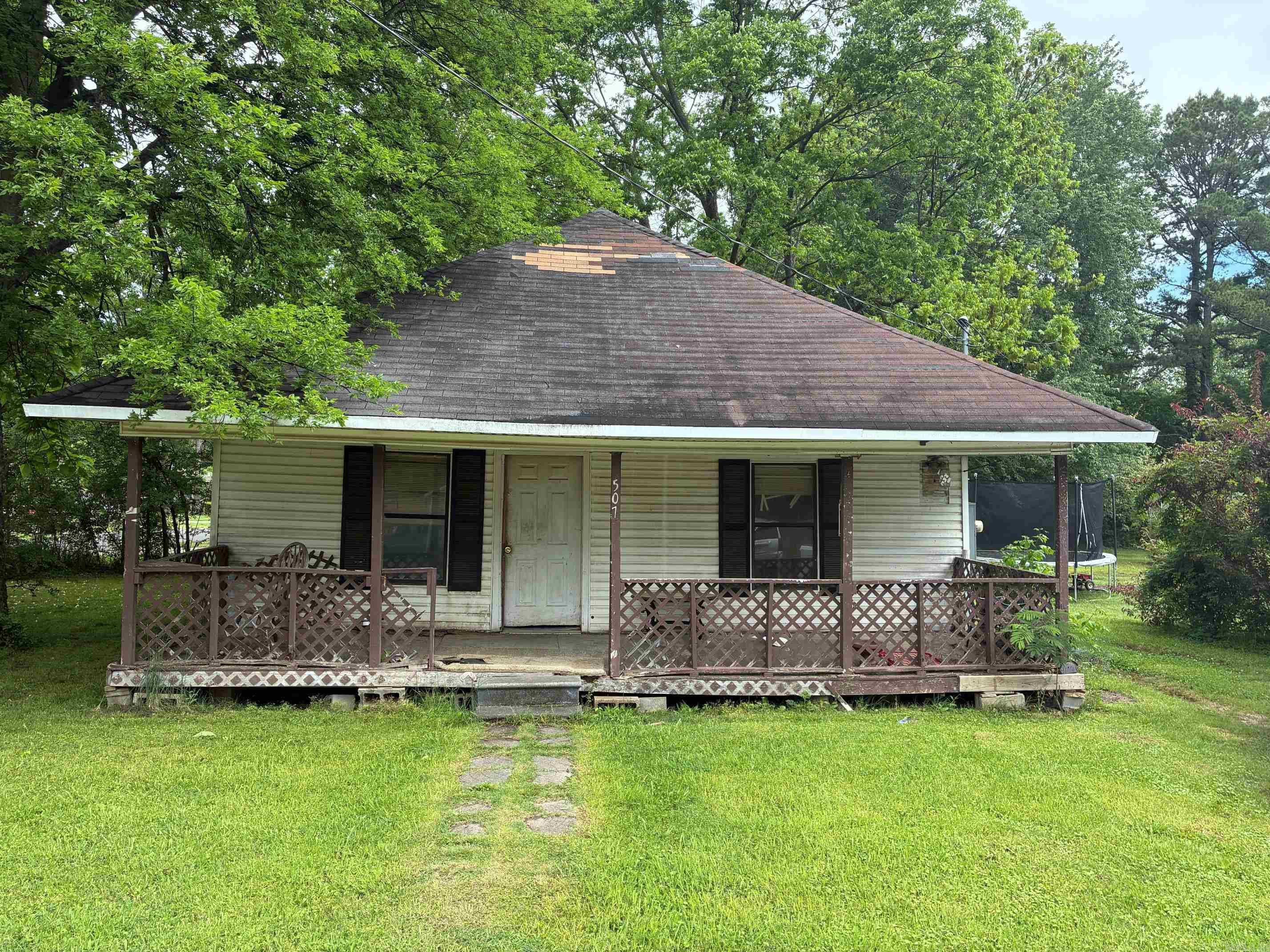 Looking for a Project in a central location?  Nice covered front porch. Vinyl siding. Corner lot. In need of updating and restoration.  No seller disclosure, priced as-is.