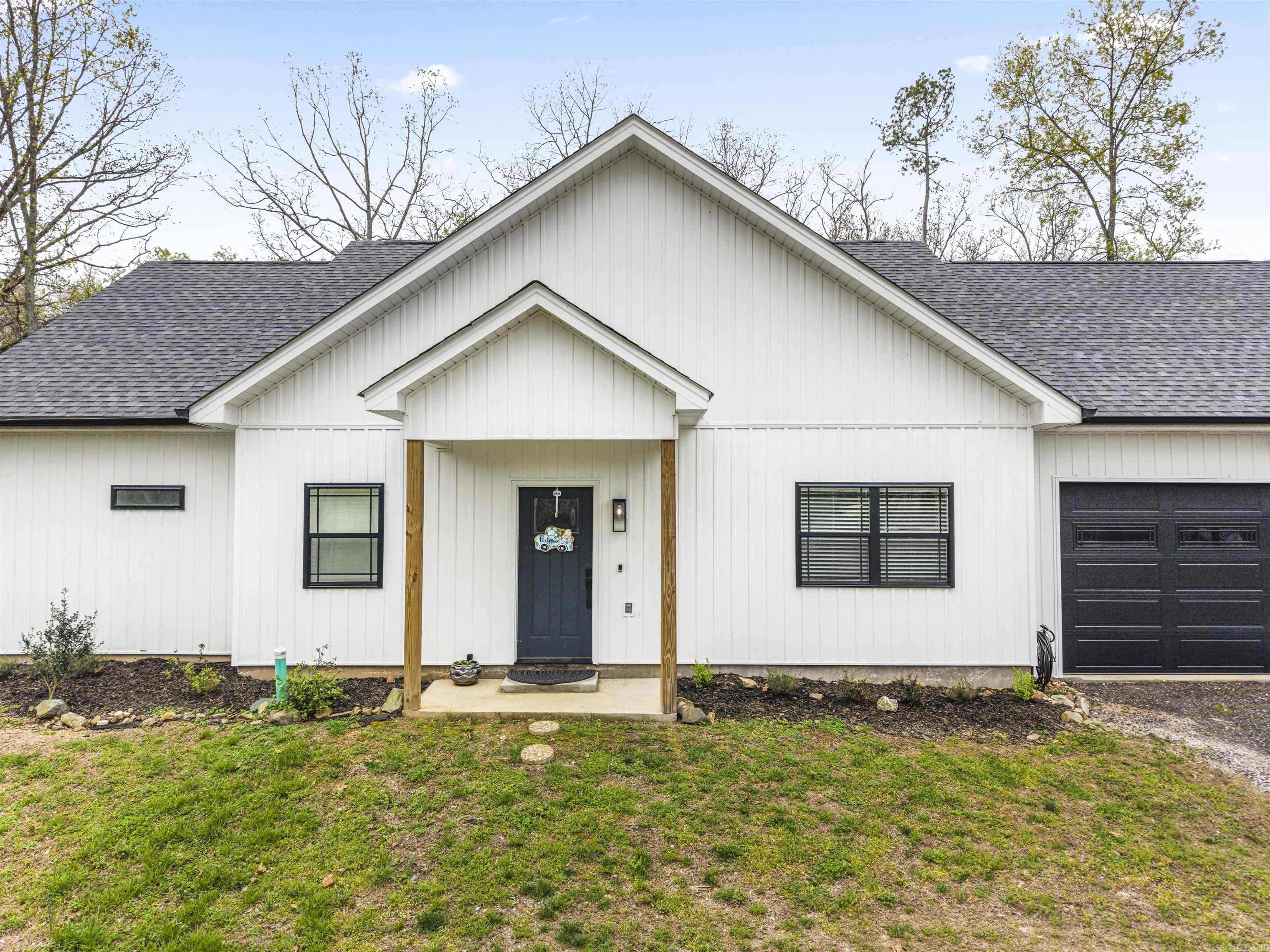 Discover your dream home at 109 Windamere Terrace in Hot Springs, Arkansas! This beautiful new farm-style home offers 2 bedrooms and 2 bathrooms across 1,713 square feet of thoughtfully designed living space. The open-concept layout creates a warm and inviting atmosphere, perfect for both relaxing and entertaining.  You’ll love the spacious kitchen featuring a unique pantry, along with a convenient mudroom that adds everyday functionality. A versatile third room provides the perfect space for a home office or additional bedroom to suit your needs.  Step outside to enjoy the covered patio, ideal for morning coffee or evening gatherings, and a separate fenced dog yard that makes this home perfect for pet lovers. The deep 2-car garage offers plenty of room for vehicles, storage, or hobbies.