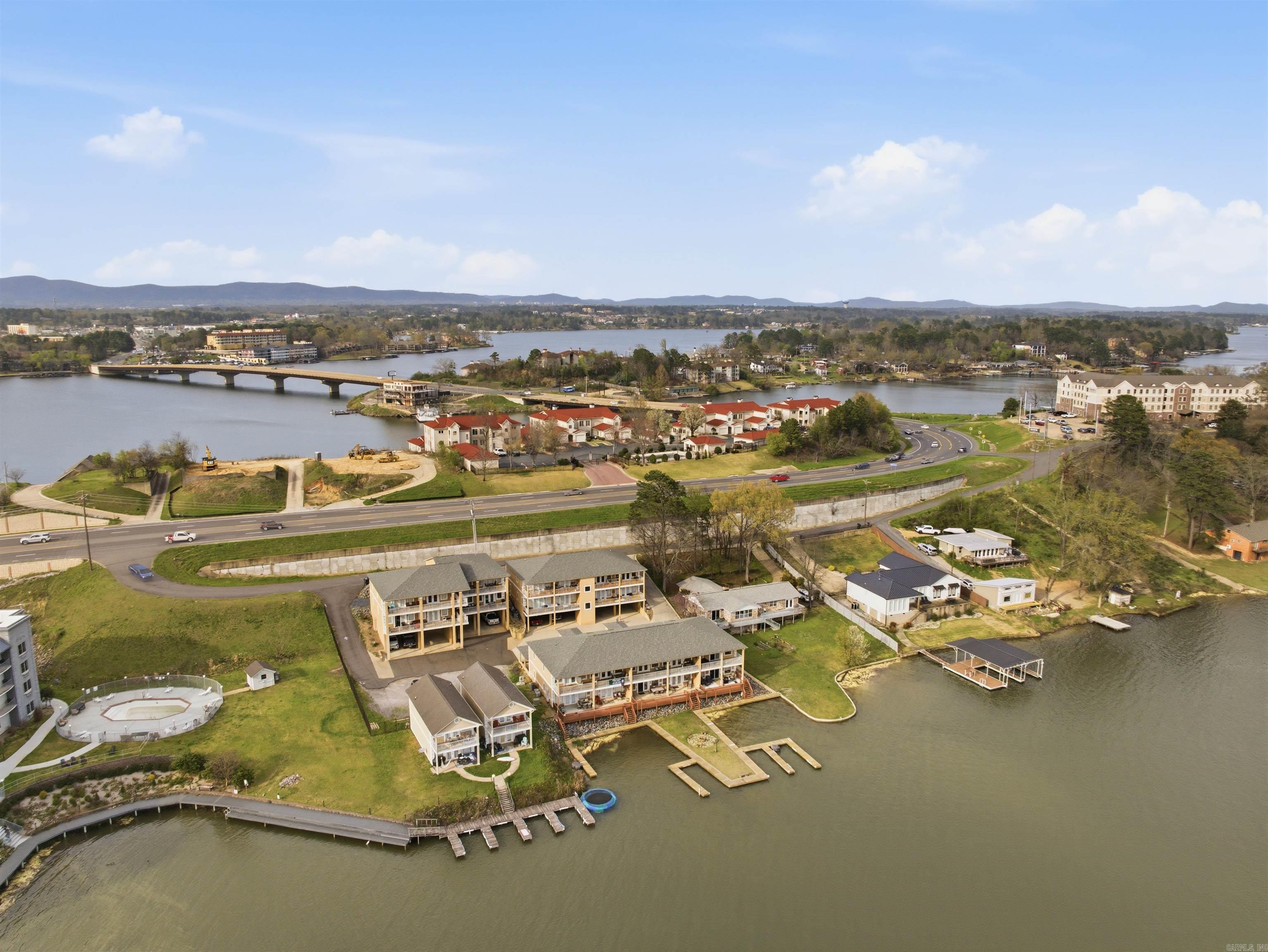 If your idea of the perfect lake place includes wide water views, easy living, and the option to generate income when you’re not using it this one checks the boxes.  This third-floor condo in Central Terrace offers beautiful views of Lake Hamilton’s main channel from both the living room and primary bedroom. The open layout creates a comfortable space for everyday living or hosting friends at the lake, and the fireplace adds a cozy touch during cooler months.  Step outside onto the spacious deck where mornings start with coffee and evenings end with sunset views over the water. Whether you’re looking for a weekend getaway, a low-maintenance lake home, or a property with strong short-term rental potential, this condo offers flexibility.  Being sold fully furnished, including outdoor furniture. It’s ready to enjoy or rent right away. One covered parking space that can fit two cars and a storage room add convenience, and the location puts you just minutes from restaurants, shopping, and everything Hot Springs has to offer.