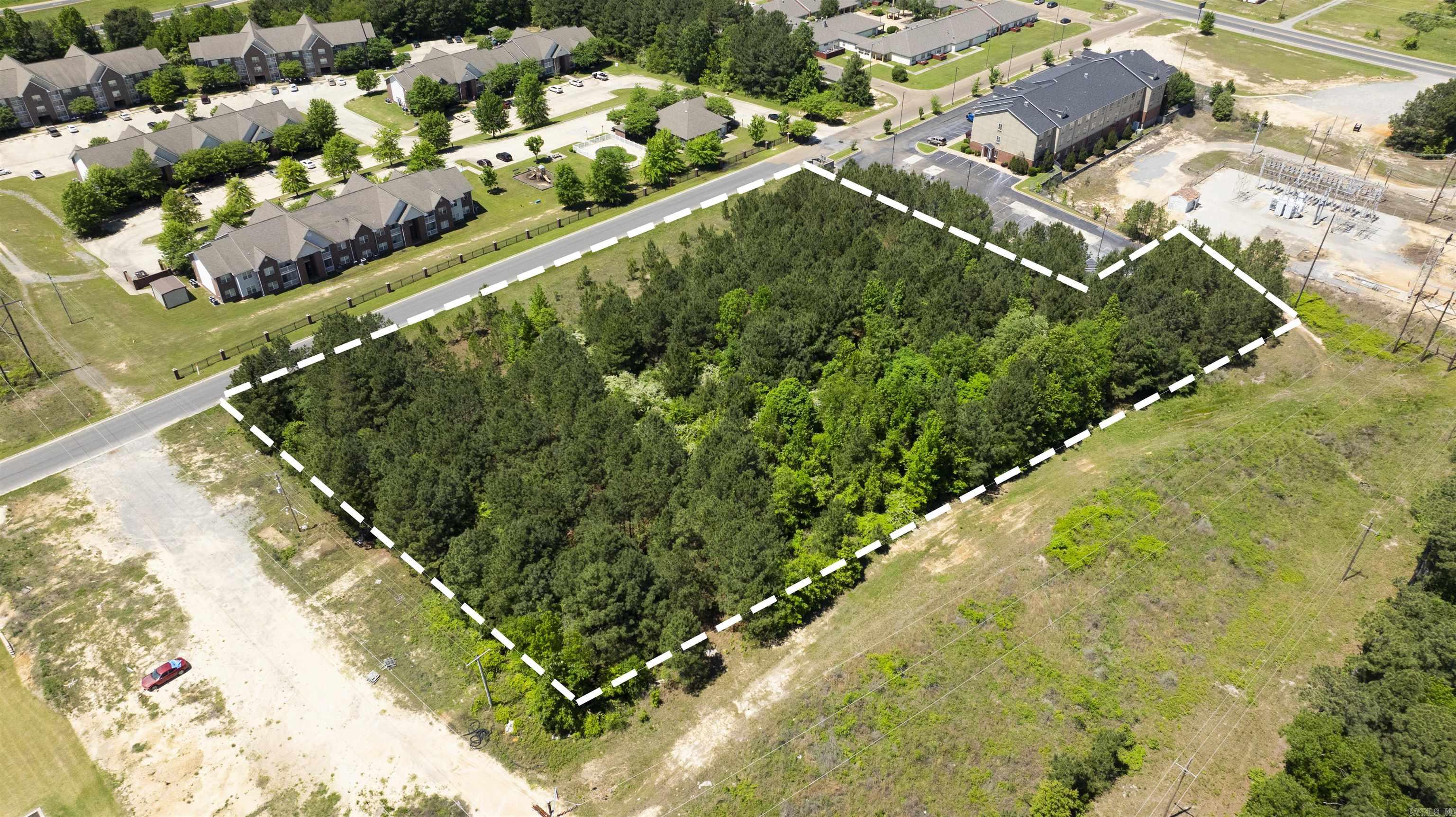 Positioned directly behind Country Inn & Suites and just off Highway 82, this 3.95-acre unimproved commercial tract offers exceptional development potential in one of El Dorado’s most active hospitality and retail corridors. Beverly Drive benefits from steady traffic flow generated by a nearby hotel, restaurants, medical offices, and high-visibility commercial activity along both Hwy 82 and Hwy 167.  This property provides a rare opportunity for a developer seeking proximity to established businesses while still enjoying the privacy, space, and flexibility of a nearly 4-acre parcel. Its location makes it ideal for multi-unit residential, office development, storage facilities, or service-based commercial concepts.