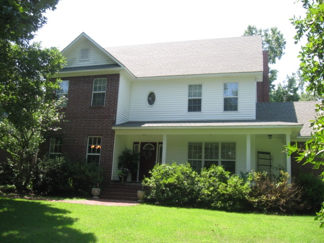 Wonderful country setting that is quiet and secluded on 3.51 acres.  Restricted subdivision with paved roads and city water.  Two story ceiling in living room and wood burning fireplace, eat in kitchen, formal dining room and master bedroom downstairs.  Upstairs has three bedrooms, 2 baths and large bonus room.  New deck and large oversized 2 car garage.  Large mature trees.  Move in ready and enjoy the outdoors!