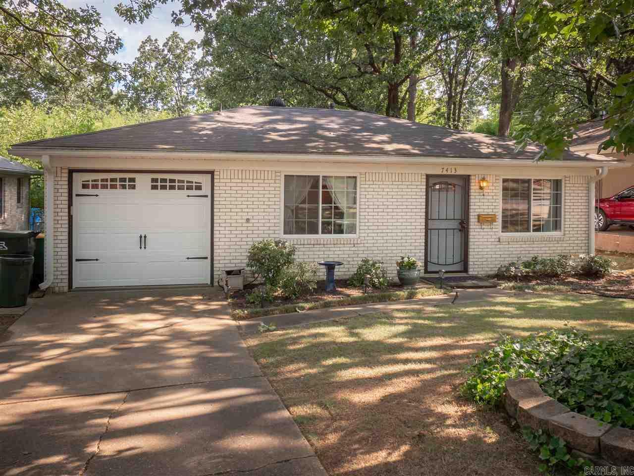 Adorable cottage in the heart of Midtown!  So much better than an apartment:  Private back yard and a garage with auto-opener!  Yes, it is small but you will use every square foot and enjoy home ownership!  Cute, clean, quiet and cozy!  Built-ins between kitchen and living room with lovely natural light.  Lovely landscaping in the front and you will love the backyard patio.  Don't miss the storage unit in the back yard!  The house is in excellent condition and ready for a new owner.