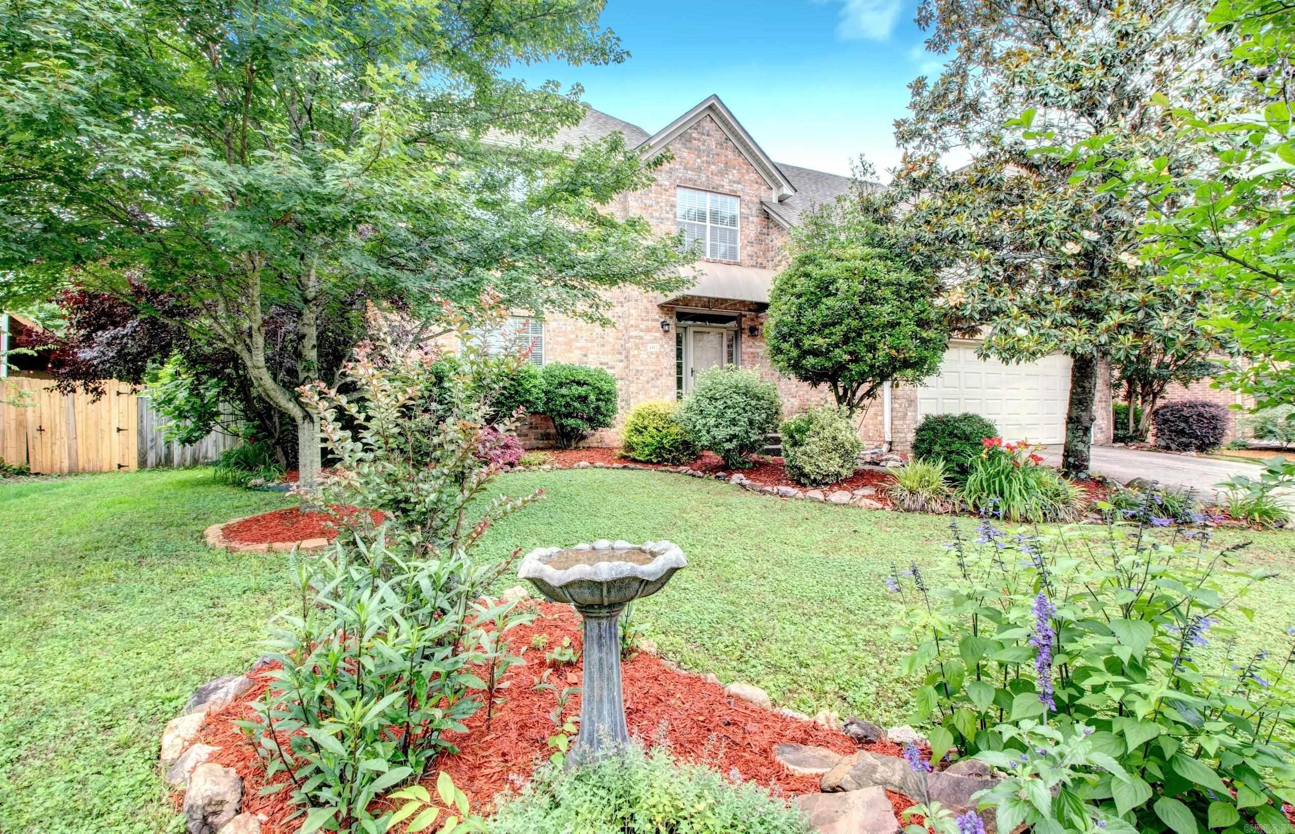 Located in the highly desirable Don Roberts Elementary School zone, this well-maintained traditional two-story home offers approximately 2,580 square feet with 4 bedrooms and 2.5 baths. The welcoming floor plan features a light-filled living room with custom built-ins, formal dining room, and an updated kitchen designed for entertaining. Highlights include granite countertops, a large island with electric cooktop, deep sink, built-in microwave, oven and a spacious pantry. The breakfast area opens to a vaulted den with a cozy fireplace, creating a comfortable gathering space. Beautiful hardwood floors extend throughout the main level. Upstairs, the primary suite features a large walk-in closet with an ensuite bath that has been freshly redone with a NEW double-sink GRANITE vanity, NEW light and plumbing fixtures & a separate shower and whirlpool tub. The hall bath, renovated in 2023, includes a walk-in shower and double-sink granite vanity. Enjoy the spacious backyard with a covered deck, basketball goal and pad, garden area, and storage building. With an acceptable offer, sellers will provide a $10,000 ALLOWANCE for FLOORING/BUYER CONCESSIONS.  UPDATES are in the agent remarks.