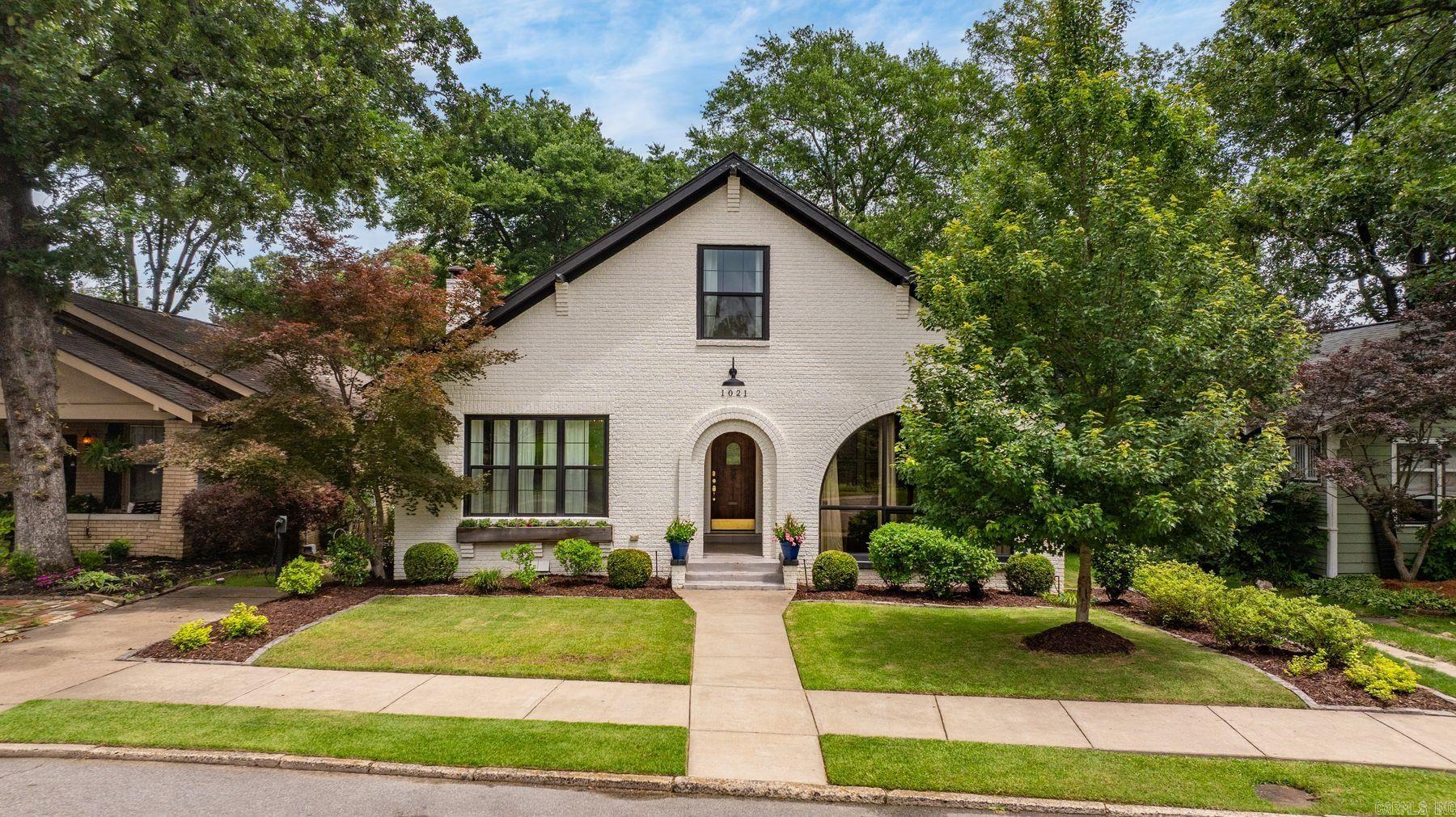 Timeless elegance meets modern luxury at 1021 N Palm. Beautifully reimagined in a major 2020 renovation, this exceptional 3-bedroom, 3.5-bath residence offers 3,201 square feet of refined living space designed for both everyday comfort and effortless entertaining. Rich hardwood floors extend throughout the home, creating a warm and sophisticated backdrop.  The main-level primary suite provides a private retreat with a spacious, well-appointed bath, while upstairs features two additional bedrooms, generous storage, and an expansive playroom or flex space ideal for media, work, or recreation. An enclosed sunroom offers the perfect setting for a private office, reading lounge, or additional living space filled with natural light. Thoughtful updates and elevated finishes blend seamlessly with classic architectural character.  Situated on a desirable flat lot, the property also offers convenient rear parking accessed from the alley — a rare and valuable feature. Every detail has been carefully curated to create a home that feels both luxurious and inviting, all in one of Little Rock’s most sought-after locations.