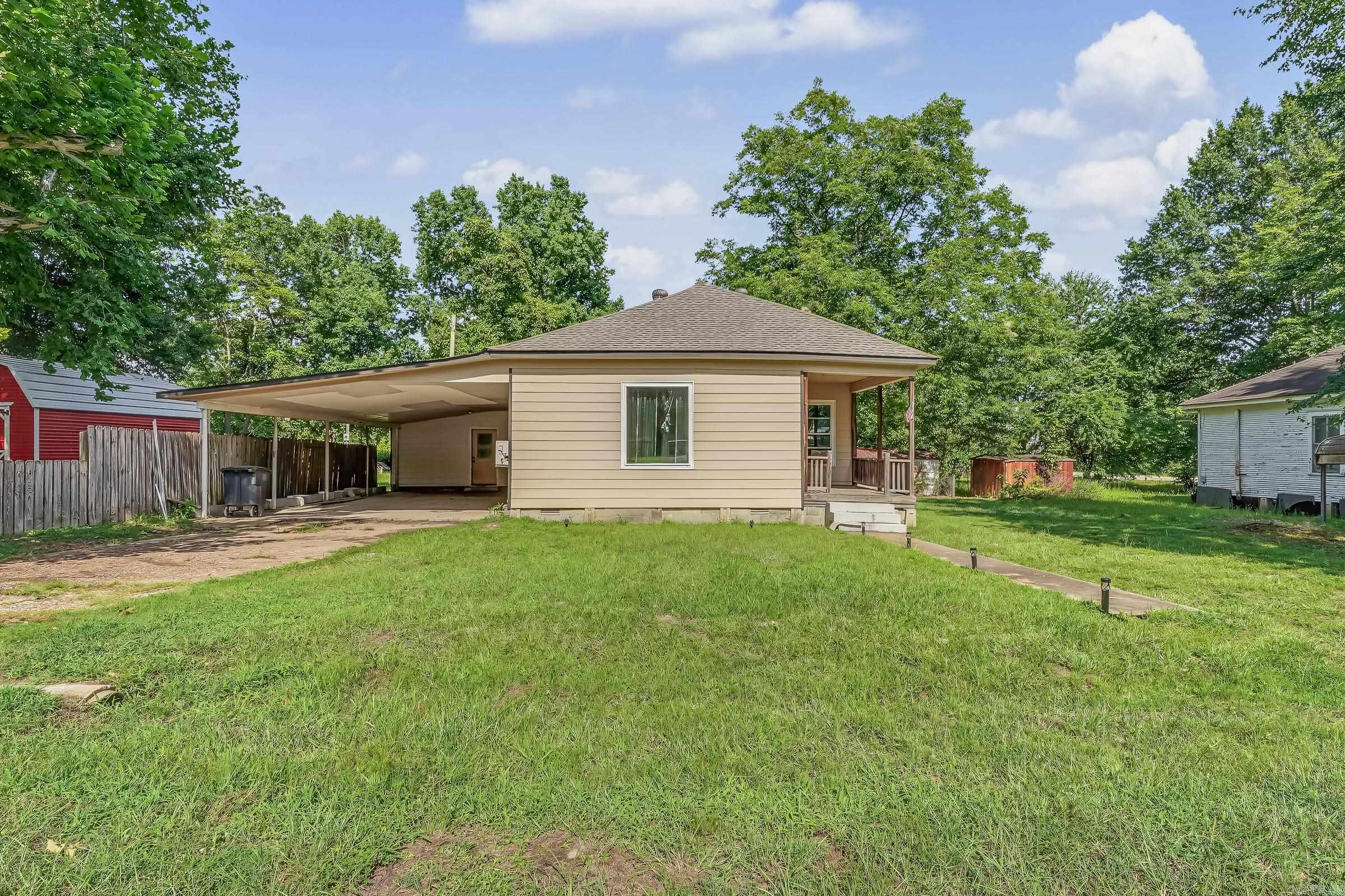 Need a nice home in Dierks? The roof was replaced in 2023-24 including boards, new drip edge and vents! In 2021 vinyl windows were installed. It has 1194 square feet plus 714 square foot laundry room. It could very easily be a 3rd bedroom. Two new mini splits (one has new wiring), and a New hot water heater with new wiring.  Now for the kitchen!!---It has a copper ceiling, new lights, newly painted, plus new flooring(tile!!). The Bathroom and one bedroom has new subfloor! So new flooring, paint, and all new Pex water lines, plus they replaced the sewer lines also.  So if you need under the house there is a light you can turn on when you enter the crawl space! Then it has a new deck including rails, new lights, a storage building, and even a storm shelter.  Sits on .48 of an acre. Do Not miss this one!!