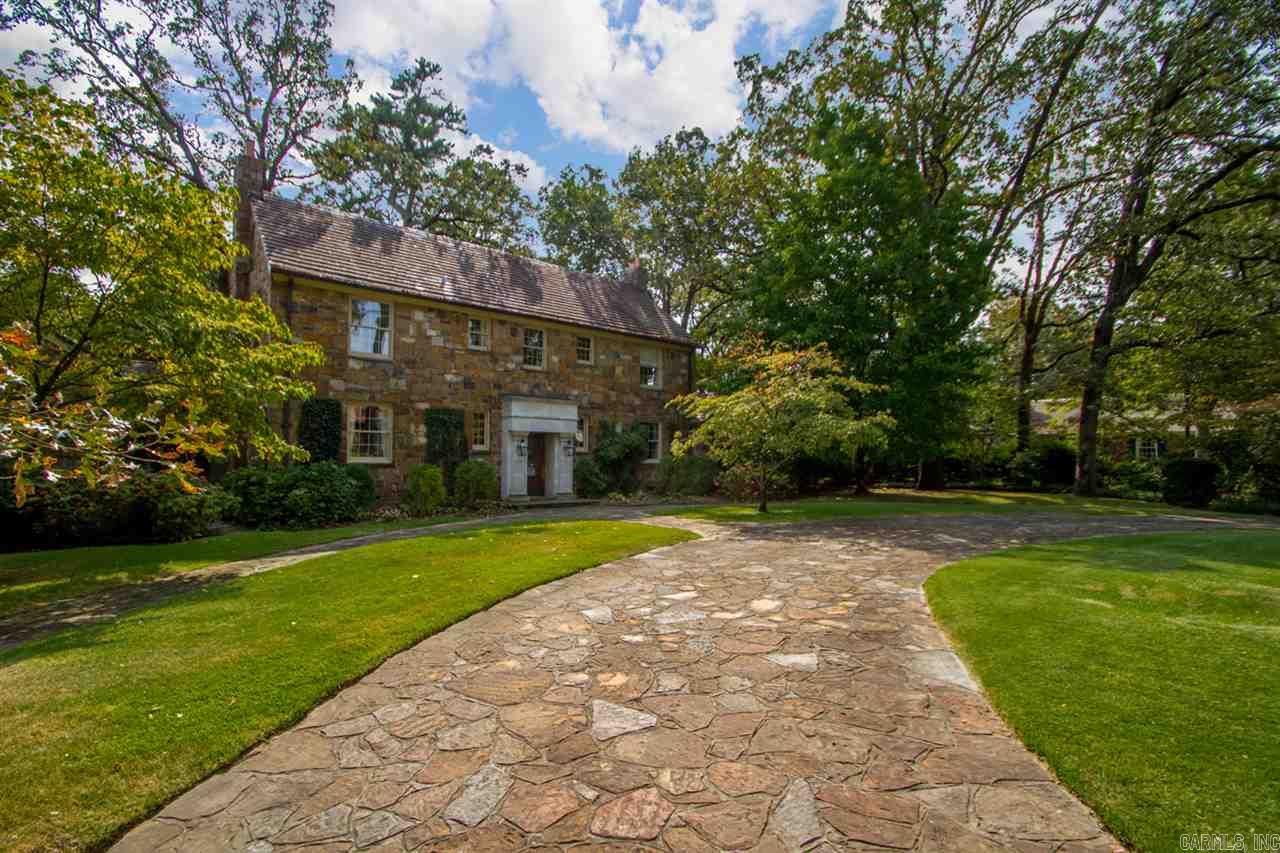 Rich in history & detail, this magnificent 2story manor home exhibits the ultimate in architectural design & craftsmanship along w/all the modern amenities. Perfect for both elegant entertaining & comfortable family living. Updated w/newer elec.wiring, plumbing, & insulated windows. 5 fireplaces. 2 Master Suites; 1 up, 1 on main. Both Masters have sep. His-&-Hers Baths. 2 addl Guest Beds up. Attic Studio on 3rd lvl. Outdoor living spaces w/covered porches, flagstone patio, & pool. Corner lot. Circle drive.