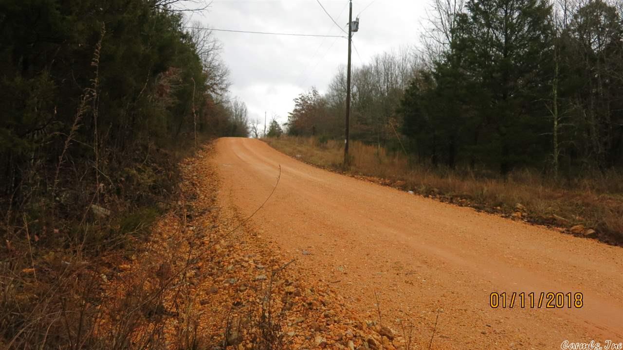 Small acreage parcel for hunting or camping in the woods. Hunting cabin  and shed both have electricity.  Cabin has a primitive indoor toilet and  kitchenette and one bunk bed.  The shed is ready to finish into a cabin or use it to store gear. Several deer stands and feeder included. A seasonal creek cuts through the property.