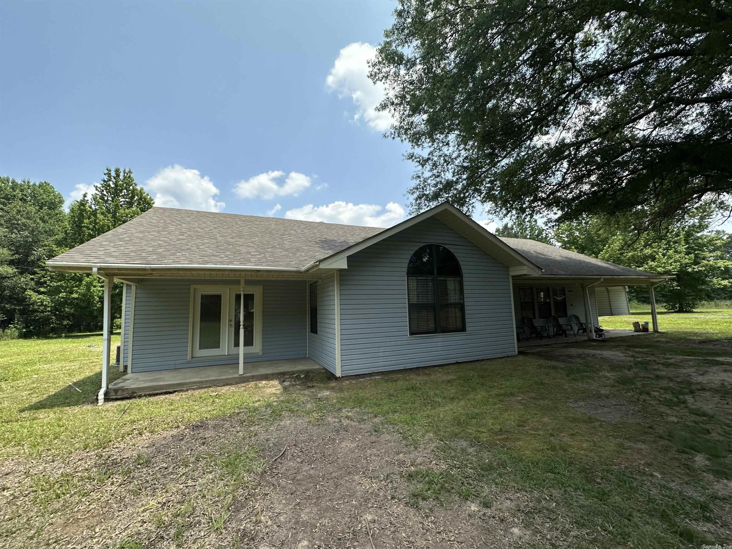 You'll enjoy country living in this large cottage, located between Foreman AR & Ashdown AR. Featuring 4 bedrooms, 2 full baths & 2large living areas, this home has it all. The master suite is massive & has tons of light, especially the expansive master bath, with a corner shower & separate tub, plus double vanities. The massive shade tree in front of home, together with the large covered front porch, create the perfect outdoor environment for entertaining or just relaxing. There are 2 additional patios, one off 2nd living room & another off the master suite which would be ideal to be enclosed with privacy fencing.