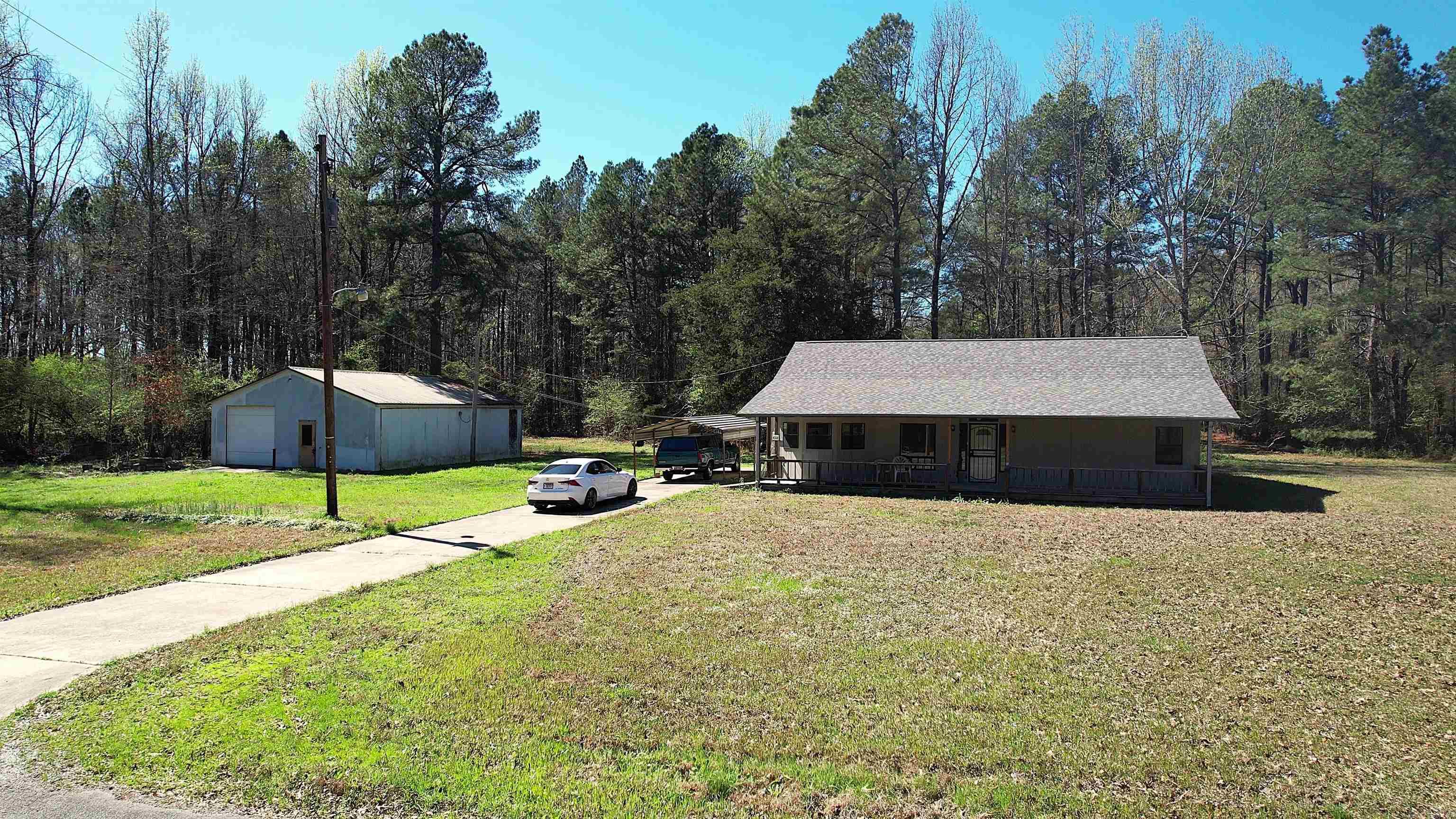 Watson Chapel schools. House on 24.35 acres has road frontage on 3 sides, and is less than 2 miles from Chapel Village Shopping! The acreage already has a secondary home site with electric, septic, and water! This 3 bedroom, 2 bathroom house is solid, built with concrete blocks! Move in ready, new roof, HVAC, water heater, carpet, bathroom flooring, paint, and wall oven. Featuring vaulted living room and primary bedroom ceilings, and has a huge shop! 32X40 shop with electricity and powered overhead door.