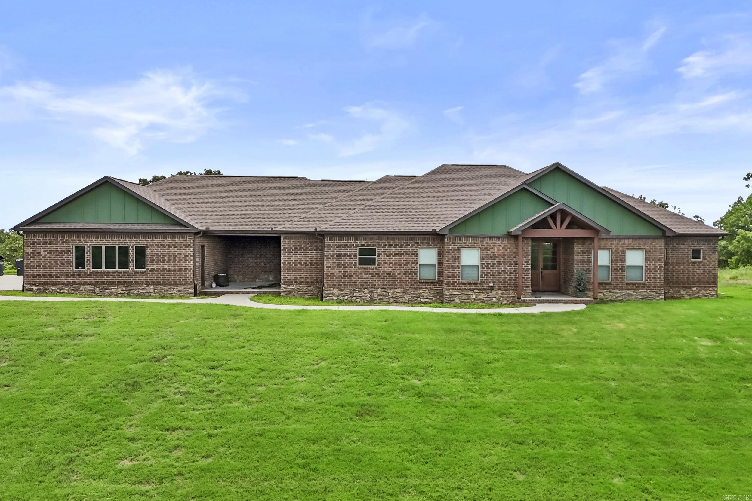 Welcome to this beautiful 4-bedroom, 3.5-bathroom home located on 4.28 acres with a picturesque view in Austin. Situated in the center of two large lots, this property offers privacy and tranquility while still being conveniently close to local amenities. The home features an open floor plan with a spacious living room, perfect for entertaining. The kitchen offers ample counter space, storage, and modern appliances, making it ideal for everyday living. Relax and enjoy the outdoors in the large 3-season room, which allows you to take in the natural beauty of the property year-round, and also includes a safe/storm room for peace of mind. Come make this your new home! Agents see remarks!
