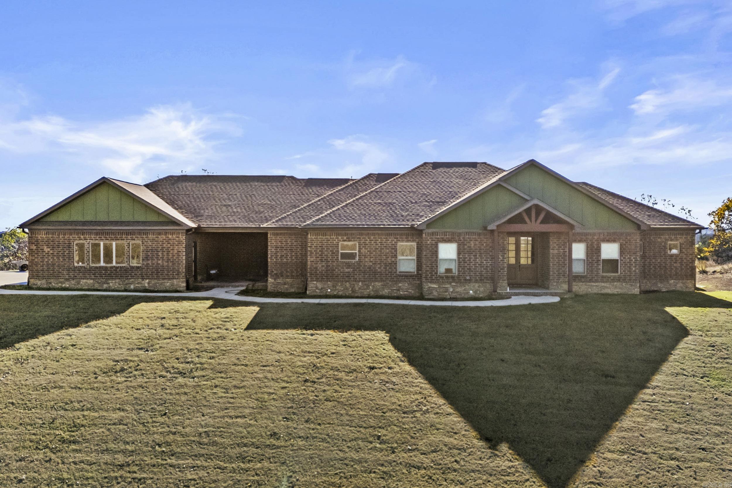 Welcome to this beautiful 4-bedroom, 3.5-bathroom home located on 4.28 acres with a picturesque view in Austin. Situated in the center of two large lots, this property offers privacy and tranquility while still being conveniently close to local amenities. The home features an open floor plan with a spacious living room, perfect for entertaining. The kitchen offers ample counter space, storage, and modern appliances, making it ideal for everyday living. Relax and enjoy the outdoors in the large 3-season room, which allows you to take in the natural beauty of the property year-round, and also includes a safe/storm room for peace of mind. Come make this your new home! Agents see remarks!