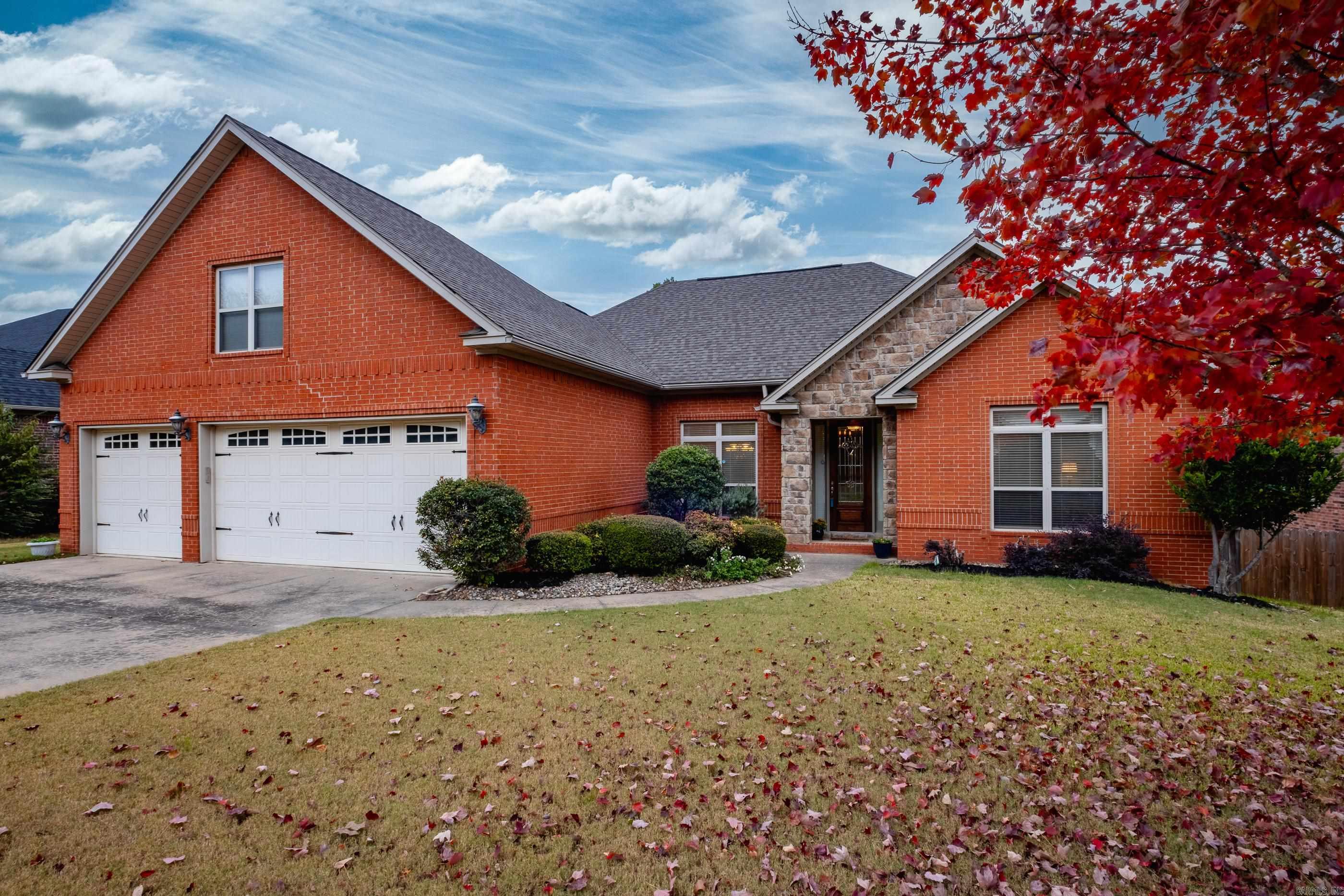 This move-in ready 3-bedroom, 2-bath home offers low-maintenance living at its finest.  With a spacious 3-car garage and a bonus room, you'll have plenty of space for storage, hobbies, or a home office. The open kitchen-living space with tall ceilings creates an airy and inviting atmosphere, perfect for entertaining guests or relaxing with family.  The oversized primary suite is a true retreat, featuring a large jetted tub and separate shower, separate vanities, and double closets. Enjoy the convenience of a sprinkler system and peace of mind on a recently replaced roof. Plus, you'll love being just steps away from a paved walking path across the street. This is an opportunity you won't want to miss!