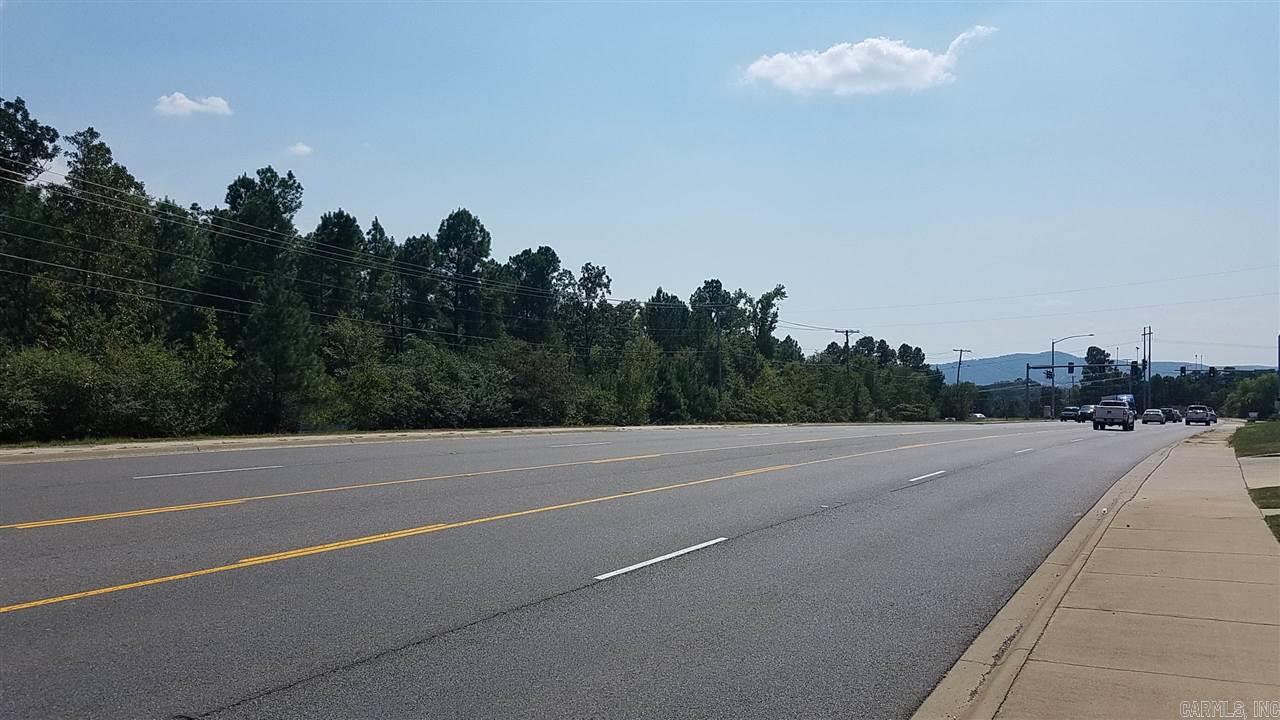 11.56 acres of Prime Development property Zoned C-4 Commercial with all city utilities. High daily traffic counts along a 5 lane road, located at a stop light intersection, in an area of current growth.   Additional adjacent acreage is available.    One of the owners is a licensed Arkansas Real Estate Agent.