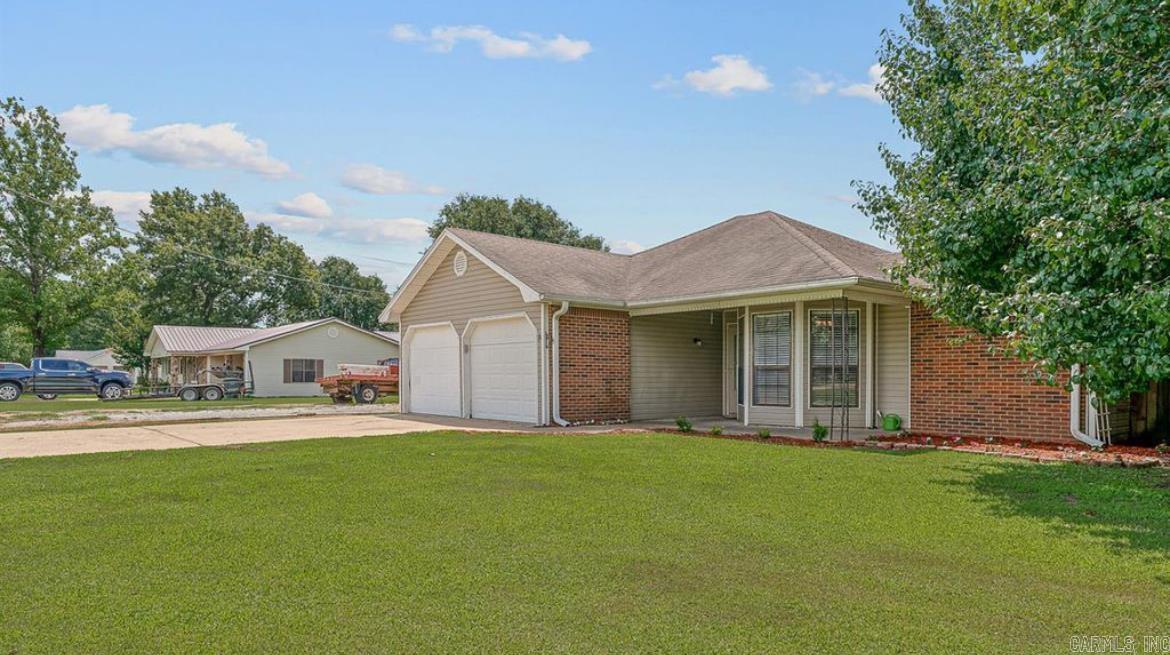 This 3-bedroom, 2-bath home is perfectly located just outside of Trumann in a peaceful rural area, only half a mile from I-555 for an easy commute. Inside, you'll find a spacious living room and a large kitchen with a breakfast bar and dining area. The kitchen features newer appliances, ample cabinet storage, and plenty of counter space.    Luxury vinyl plank flooring runs throughout the home, and both the master and guest bathrooms have been tastefully updated. A generous mudroom and laundry area connect the garage to the main living space  perfect for kicking off dirty boots after working in the new shop, which has its own separate entrance from both the road and the house.    The fenced backyard includes an additional storage shed and a patio, ideal for grilling and relaxing in the evenings. This well-maintained home is full of upgrades and truly move-in ready.    Call today to schedule your private tour!