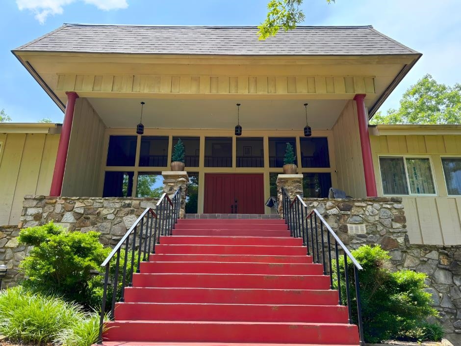 NEWLY REDUCED PRICE!  Don't miss out on this charming, spacious and private home located in the heart of Cherokee Village. Surrounded by the beauty of the Ozarks, this classic 5000 square foot property is the perfect place to call home, make your relaxing get-away or a smart investment opportunity. This property offers updates throughout, while holding on to the nostalgic charm.  Step inside the beautiful glass entry to find the gorgeous wooden staircase heading to the upstairs bedrooms/bathrooms, a whimsical spiral staircase leading downstairs to the open game room/bathroom, down the hall to more main level bedrooms/bathrooms or walk across the entry to find a great living room that offers plenty of space for gathering. Open kitchen, dining and bar area with full view of the enclosed heated pool makes entertaining for all ages easy and fun. Whether you are sipping coffee on the back deck or taking in the peaceful views of nature The McCabe House offers that true small-town Arkansas warmth. Don't miss out on the opportunity to own a slice of Cherokee Village history and hospitality.  Call for your tour today.