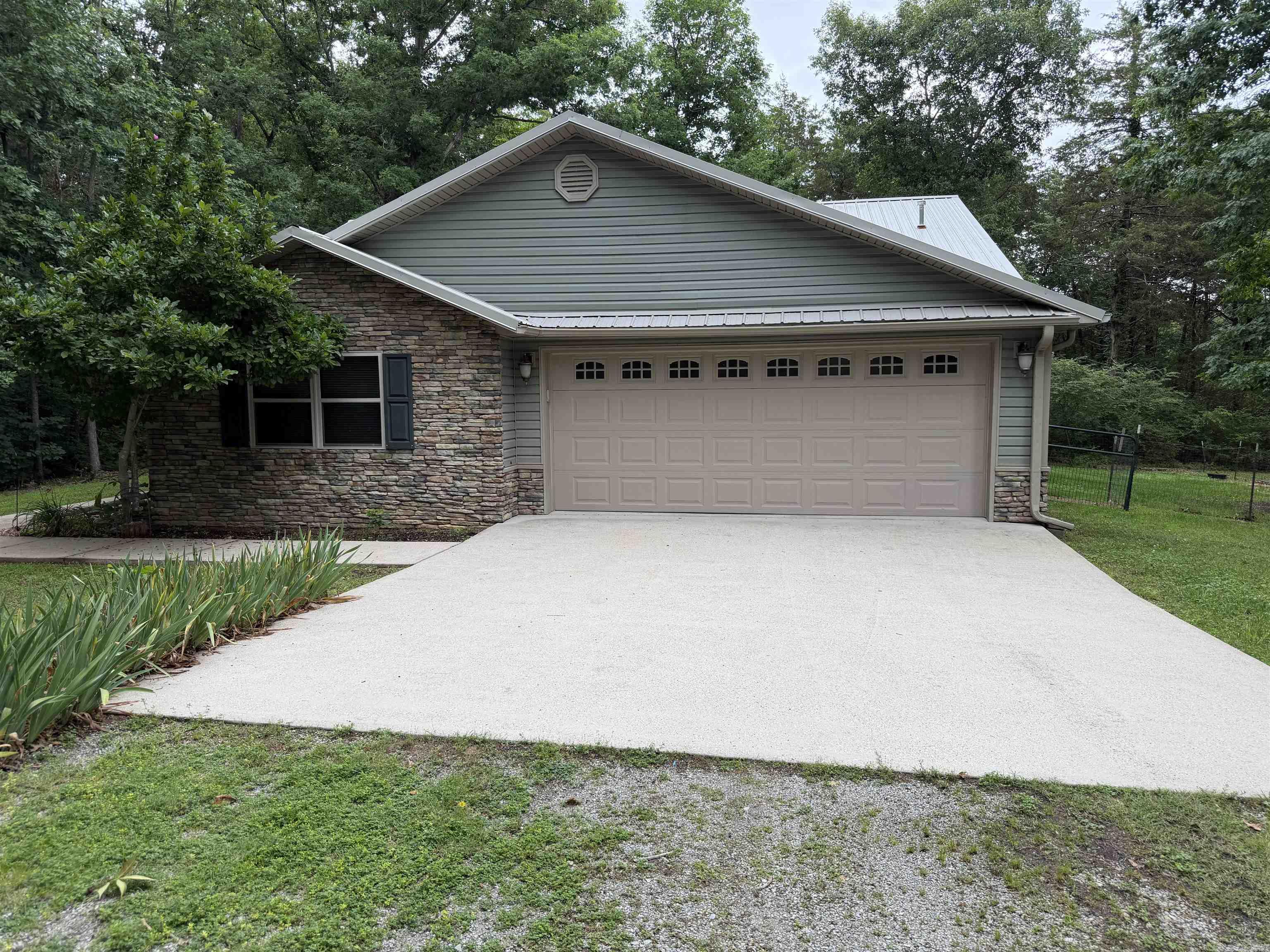 For Sale in Beautiful Mountain View AR, sits this quaint two bedroom , two bath, 1623 sq ft. home sitting on 1.25 acres M/L with shaded yard. The Home offers a two car garage, vinyl siding with decorative stone, a nice concreat pad for parking, The inside has a spacious living room, and dinning area that opens up to a large kitchen with stainless appliances, and lots of cabinet space. There are two covered porches for that afternoon or, morning coffee enjoyment. This home has been very well taken care of. Don't miss your opportunity to own your place in the Ozarks.