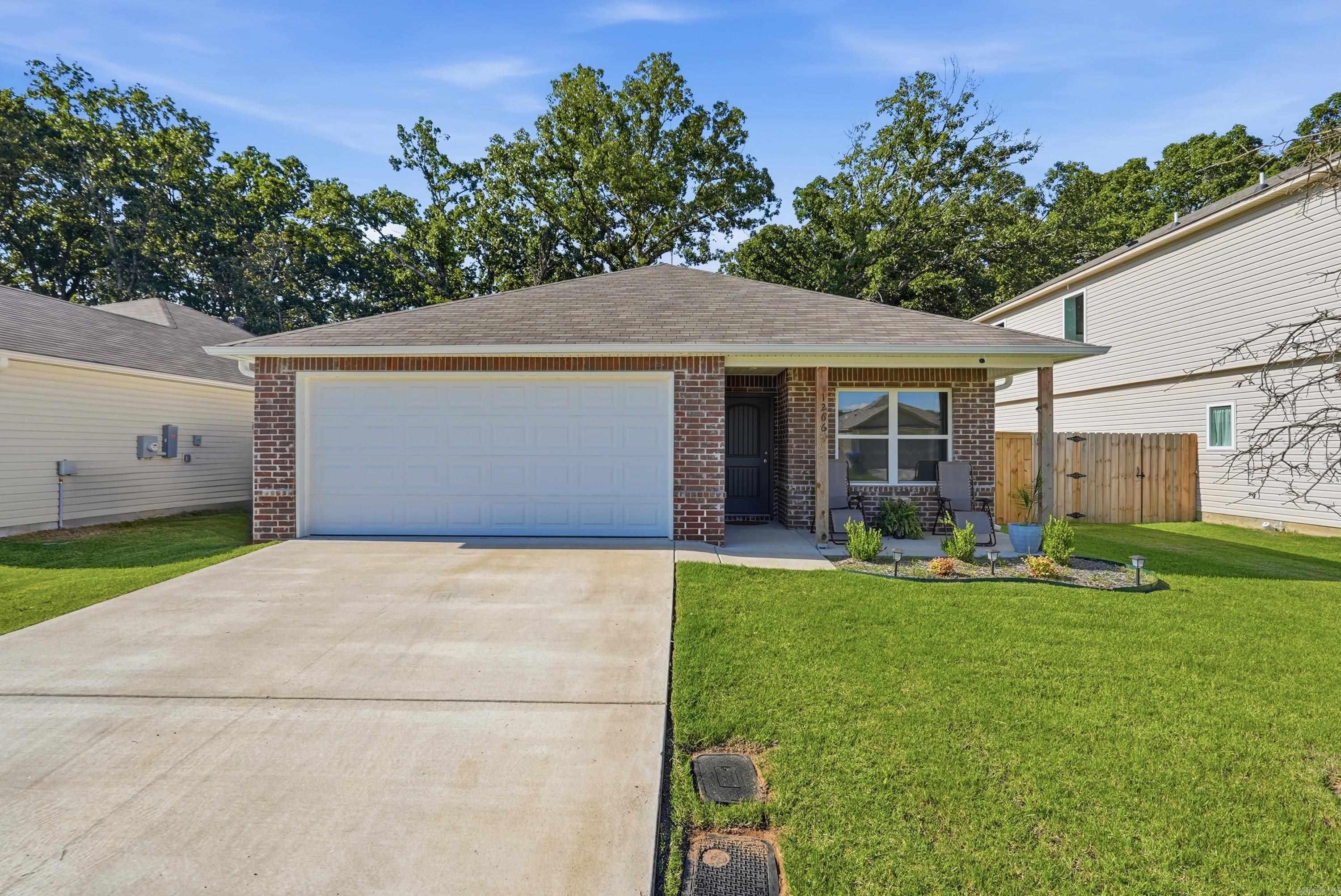 Built in 2025, this like-new 4-bedroom, 2-bath home offers modern living in an unbeatable location.  Inside, you'll find a functional layout with plenty of space for family, guests, or a home office. Everything still has that fresh, move-in-ready feel, allowing you to enjoy the benefits of new construction without the wait.  Step outside to a fully fenced backyard with a peaceful backdrop of woods behind the property, providing added privacy and a quiet place to relax or entertain.  Conveniently located in the heart of Conway, you're just minutes from I-40, shopping, restaurants, schools, and everyday conveniences. It's the perfect balance of being close to everything while still enjoying a private backyard setting. If you're looking for a like-new home with four bedrooms, a great layout, and a fantastic Conway location, this is one you won't want to miss.