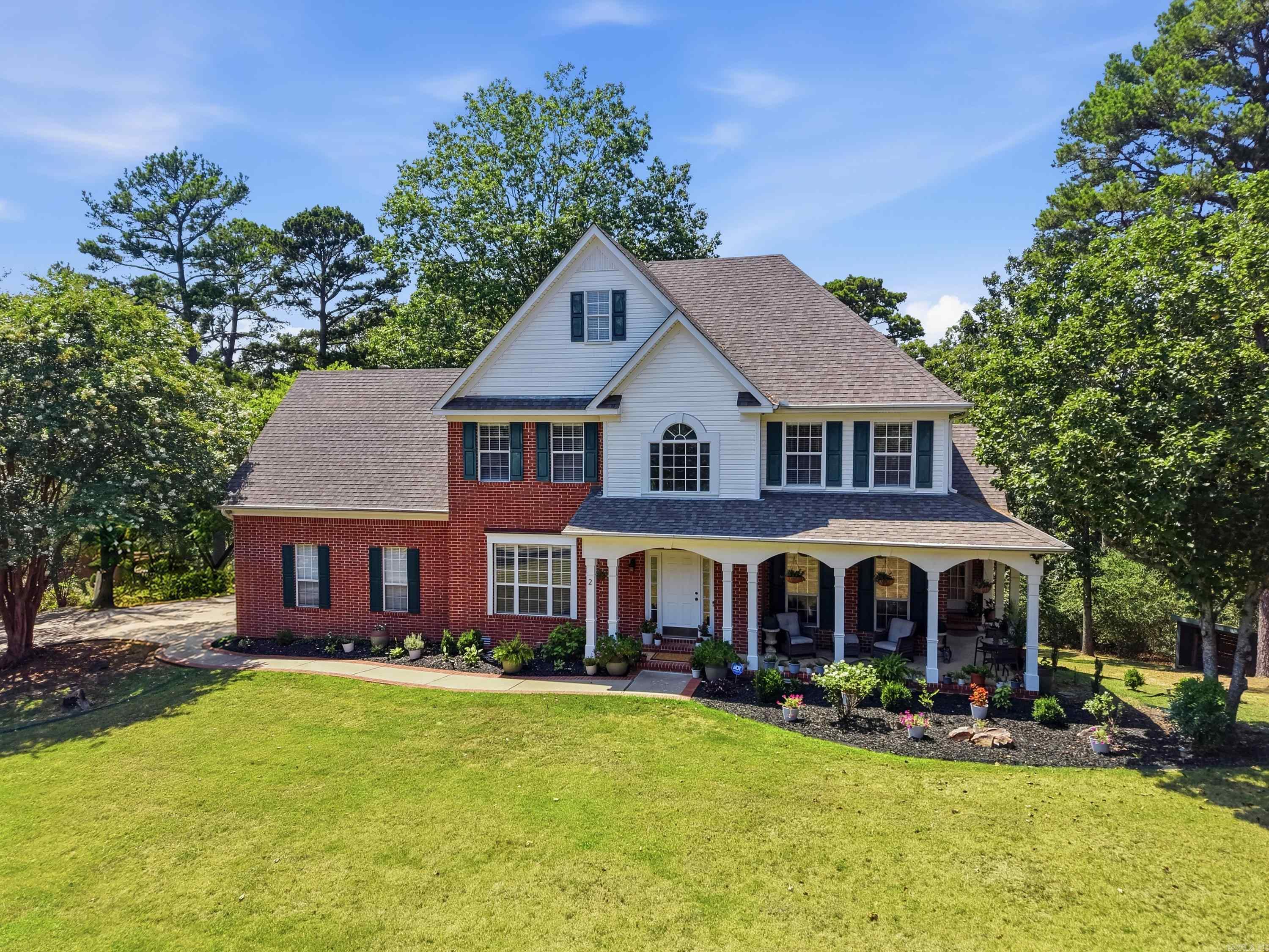 For the first time in years, the opportunity to live in Richland Hills has opened. Homes in this sought after Faulkner County neighborhood rarely become available, and this custom-built showstopper will make you never want to leave.  Prepare to fall in love with the soaring ceilings, floor-to-ceiling windows, and designer touches at every turn, flooding the home with light and luxury.  The Chef's Kitchen is equipped with new stainless-steel appliances in 2025, granite countertops, a spacious island with seating, generous cabinetry, and opens to multiple living spaces. In addition to five spacious bedrooms, there is a Bonus Room with a walk in closet which can easily be a very large 6th Bedroom, Game, Theatre or Homeschool Room. The finished walk-out basement adds an entire second living space with a bedroom, living area, and full bath. Step outside through the double doors and exhale. An expansive deck overlooks 1.25 landscaped acres with a creek, golf course views, gorgeous sunsets, and deer at dusk. This luxurious home is located ten minutes from I-40, and twenty minutes from Little Rock. Extensively upgraded since 2022 and priced below appraisal! Truly a rare gem. Welcome Home!
