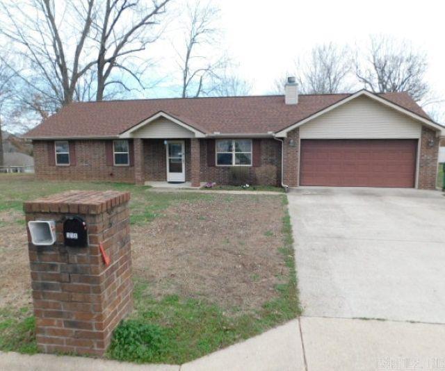 Welcome to this well-maintained 3-bedroom, 2-bath home located in a quiet and established neighborhood. Featuring a combination of brick and vinyl siding and a newer roof, this home offers both durability and curb appeal on a nice-sized, level lot. Inside, you’ll find an inviting open living space that combines the living room, kitchen, and dining area, creating a bright and spacious atmosphere. A cozy fireplace serves as the centerpiece of the room, perfect for relaxing evenings at home. The property includes a convenient two-car garage with a built-in tornado shelter for added safety and peace of mind. Outside, the flat yard is partially enclosed with a charming older picket fence and includes a small storage shed for lawn equipment or extra storage. This well-cared-for home also comes with kitchen appliances as well as the washer and dryer, making it truly move-in ready.