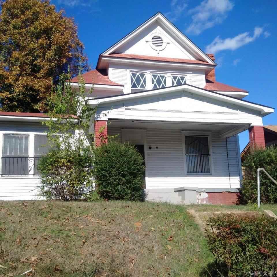 The M P Duke House located in the Central High Historic District. Home has some electrical and plumbing updates, had a small fire in the past and resulted in the removal of the rear dual porches. Home is listed as none noncontributing to the district and does not qualify for state tax credits. Large foyer flanked with bookcases and columns, original tile on fireplace, over sized dining hall with plate rack, many wonderful architectural details. Home still needs a restoration, sold as is no repairs.