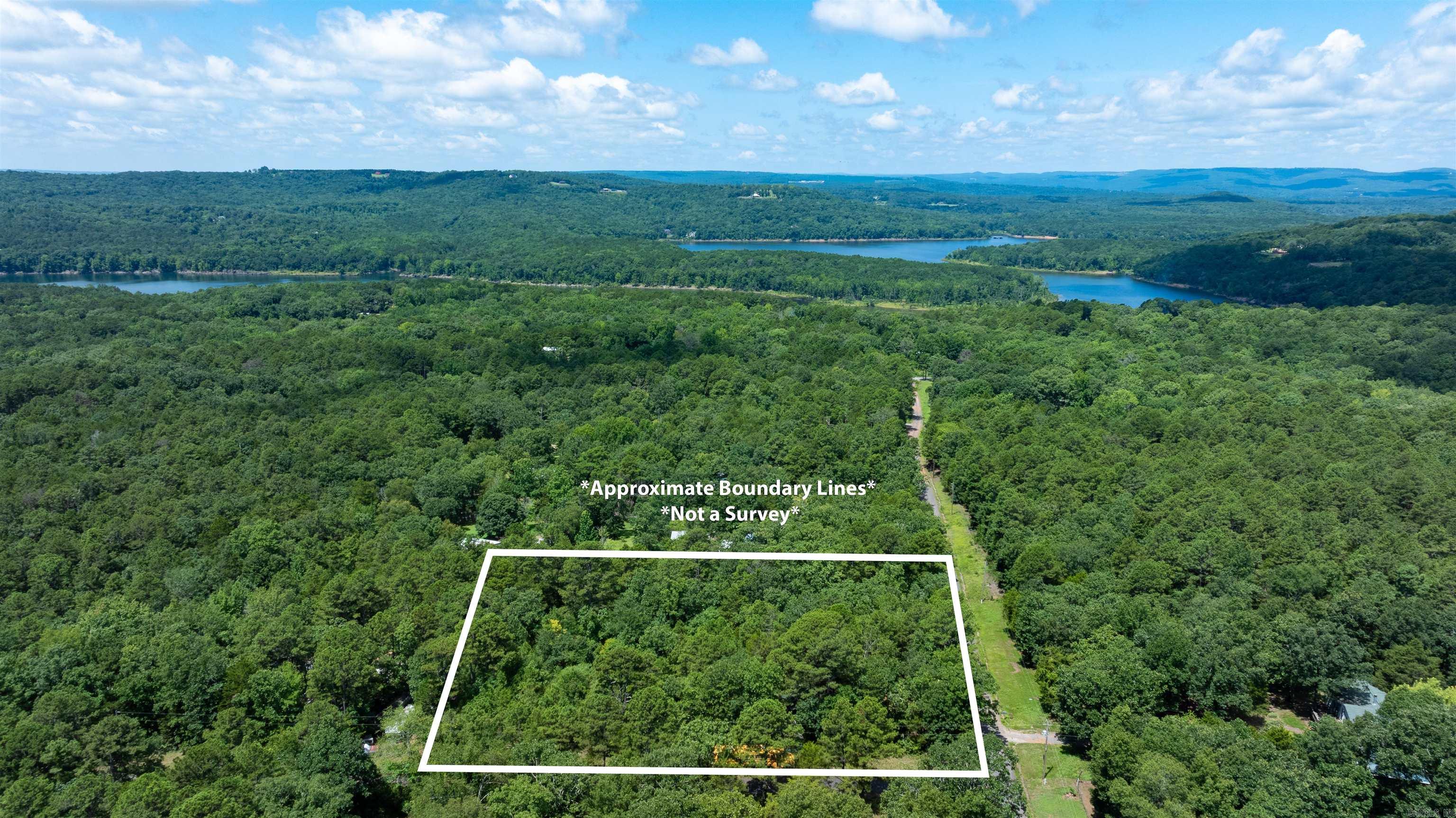 Looking for the perfect place to enjoy Greers Ferry Lake? This beautiful 1.39 +/- acre level corner lot is located in the Sills Peninsula area at the corner of Grady Road and Hemphill Lane, just two blocks from a public boat launch. With no restrictions, you have the freedom to build your dream lake home, cabin, barn dominium, or simply set up your RV or camper and enjoy weekends at the lake. Electricity, and fiber internet are available along the road, making this property ready for your vision. Greers Ferry Lake is known for its crystal-clear water, outstanding fishing, boating, swimming, and year-round recreation. Conveniently located just 10 minutes from Clinton and Fairfield Bay, you'll have easy access to shopping, dining, marinas, and everyday amenities while still enjoying the peaceful atmosphere of lake living. Whether you're looking for a weekend retreat, full-time residence, or investment property, this unrestricted lot offers endless possibilities in a fantastic location. Don't miss this opportunity to own your own piece of Greers Ferry Lake paradise!