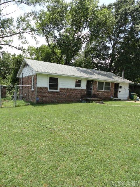 Huge price reduction.  3BR/2BA. Large lot. 2 Living areas. Formal LR with beautiful original hardwood floors. Den with new carpet and wood burning stove. Remodeled eat-in kitchen w/ nice cabinets (some glass front), gas stove, recess lighting, and lots of storage. Ceiling fans in all BRs, Living areas, kitchen, & laundry. Fenced yard w/storage building. New sewer line. Roof approx. 6 years old. Home warranty conveys. Security doors. Exclude curtains in girl's room. Sq Footage approx. Feel free to measure.