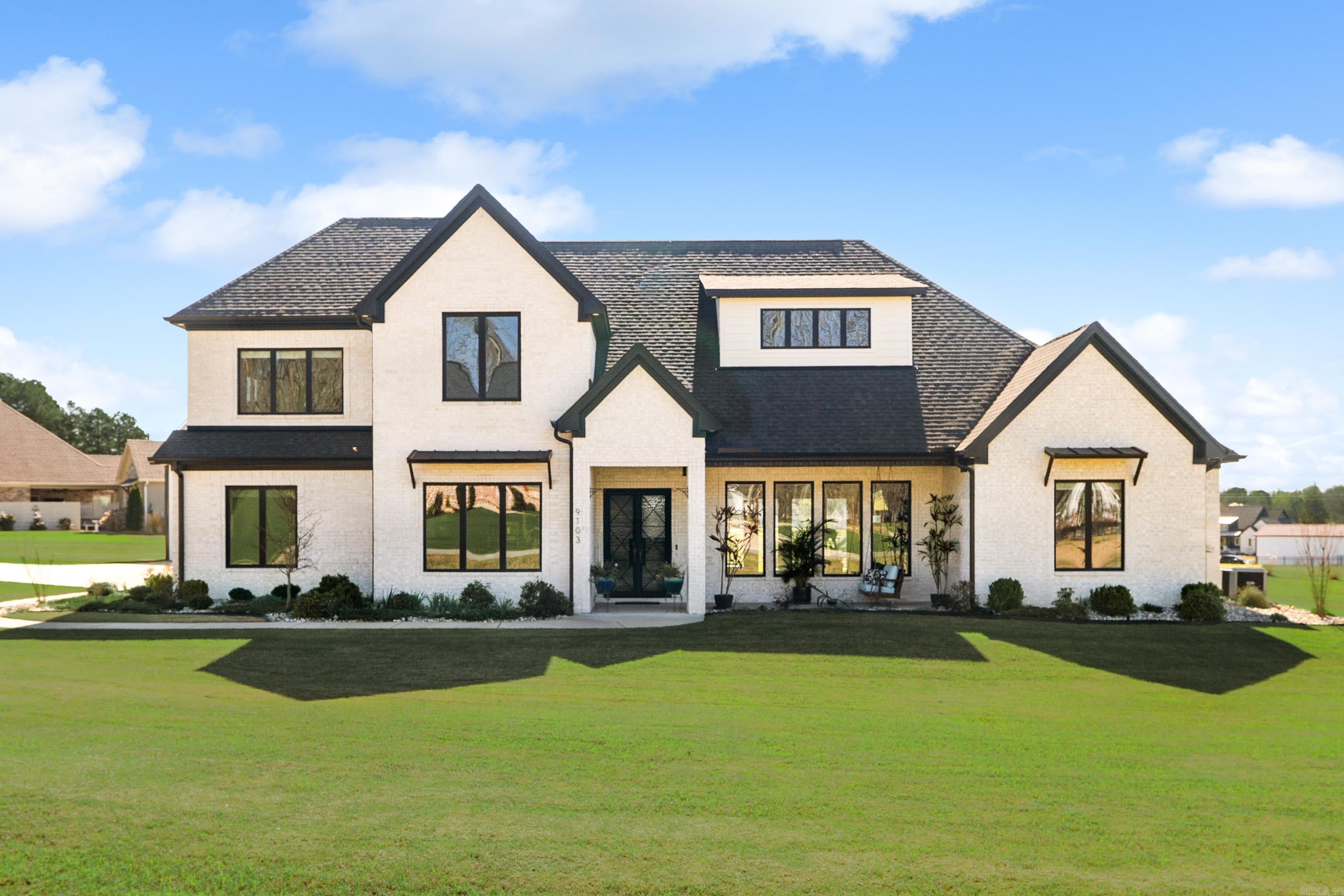 Immaculate modern farmhouse in a gated subdivision on just over an acre. From the moment you arrive, the double iron front doors, gabled entry, & charming front porch set the tone for this exceptional home. Inside, you’ll find open-concept living, 12-foot ceilings, stone-accent fireplace, cabinetry, stained floating shelves, & abundant natural light pouring through tinted picture windows. A chefs dream kitchen- featuring contrasting black & white quartz countertops, double fridge/freezer (that stays!), built-in ice maker, and gas 5-burner stove—setup for everyday living and entertaining. The spacious walk-in pantry offers cabinetry, quartz, & generous shelving. Primary suite on main level is a private retreat with vaulted ceilings, back porch access, & large picture windows. The spa-like bath includes a pass-through shower, soaking tub, along with a walk-in closet. Also downstairs: a dedicated office, half bath, laundry room, & mud room. Upstairs offers two spacious en-suite bedrooms and a large bonus room that can be a 4th bedroom, media space or playroom. 3-car garage plus a 30x32 shop- ideal for hobbies or storage. Thoughtful details, premium finishes, & room. Truly a must see!