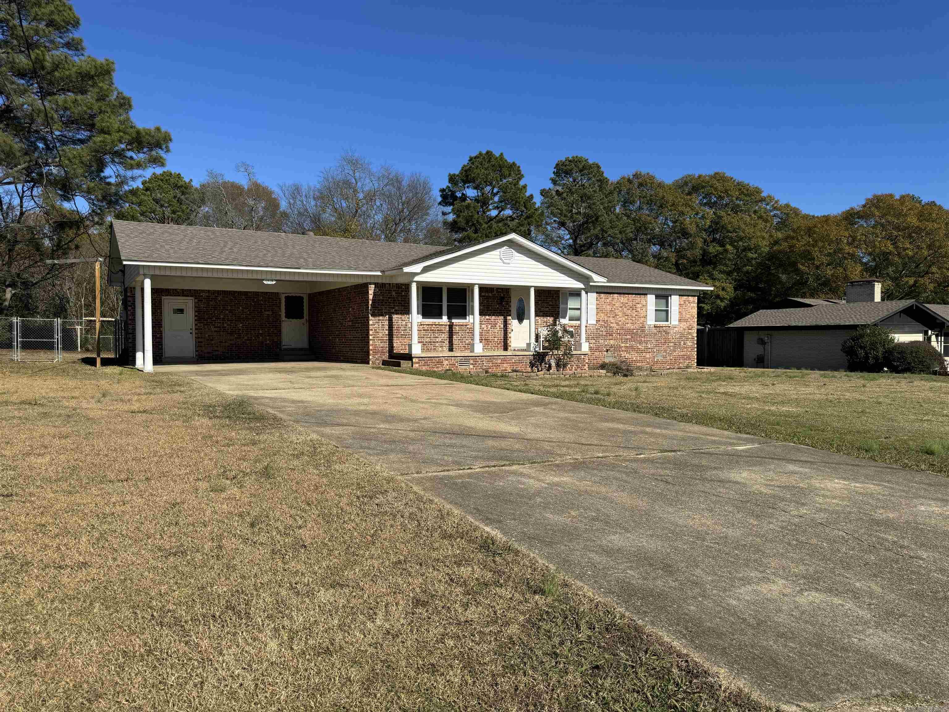 WOW  What an adorable home.  This home was completely remodeled recently.  It offers an open floor plan with lots of natural lighting.   Carpets in bedroom look great and recently cleaned.  Separate laundry room off kitchen with large closet.  Tub showers in both baths.   Kitchen has tile Countertops as well and time back splash.  All neutral colors throughout the home and upgraded laminate flooring in living, dining and Kitchen,  Tile in Laundry and baths and carpet in bedrooms only.   Outside offers a LARGE fenced backyard. Tax amount does include the homestead amount of 425.  This is a must see.   AGENTS SEE AGENT REMARKS PRIOR TO WRITING AN OFFER