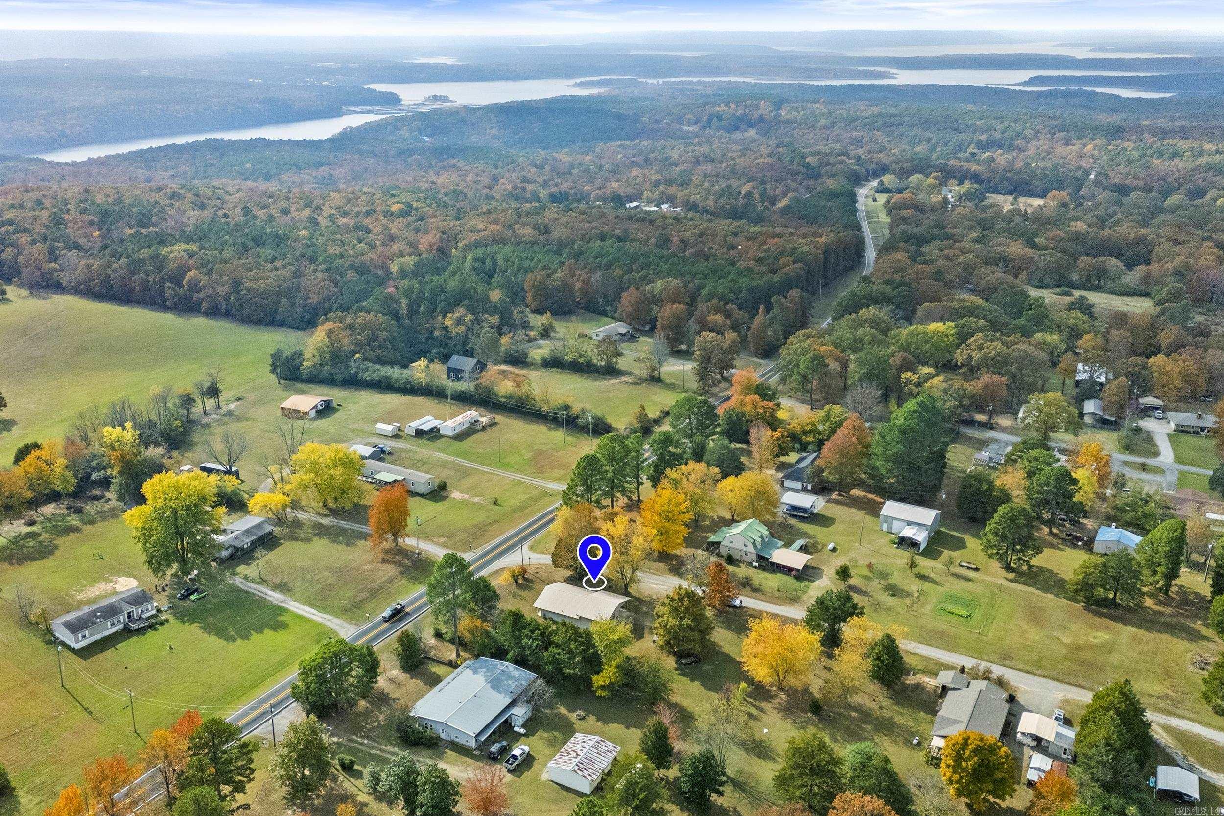 Welcome to 4 Persimmon Lane in Tumbling Shoals. This charming split-level home offers a comfortable layout and peaceful setting just Minutes away from Greers Ferry Lake!! Enjoy peace of mind with a metal roof, storm shelter and multiple outbuildings- perfect for extra storage, hobbies or lake gear. Whether you're looking for a full-time residence or a relaxing weekend getaway, this property offers the perfect blend of comfort, functionality, and lake life living!