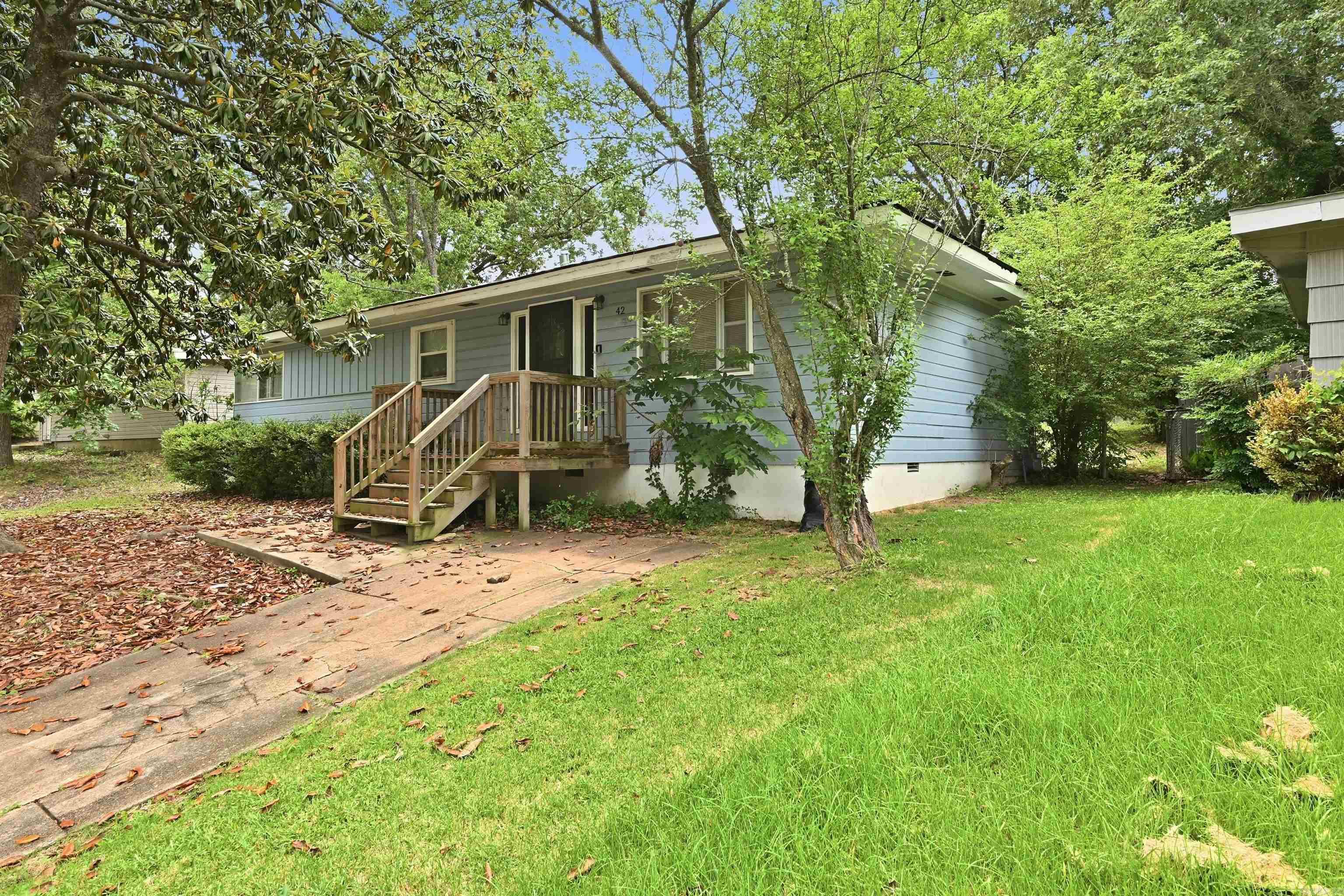 Tucked away in the established Meadowcliff subdivision, this well-maintained 3-bedroom, 1.5-bathroom traditional home offers 1,248 square feet of comfortable living space. The residence features a functional one-story layout on a crawl space foundation, complete with a cozy fireplace and a kitchen/dining combo ideal for gatherings. Recent updates including a newer roof (2025) and HVAC system (2024/25) provide added peace of mind for future owners. The property sits on a sloped 0.22-acre lot that is partially fenced, offering a private outdoor retreat. This home is perfectly situated for easy city living, located just minutes from local favorites like the University of Arkansas at Little Rock (UA Little Rock) and the shopping centers along University Avenue. Commuters will appreciate the close proximity to I-30, providing a quick connection to downtown Little Rock and the surrounding metro area.
