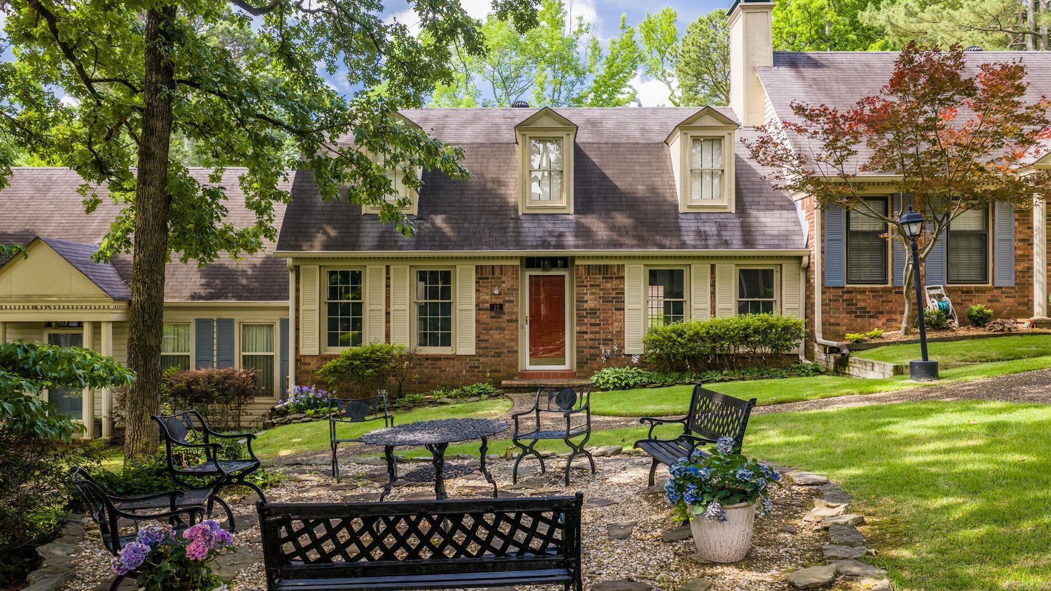 Wonderful one-owner condominium in West Little Rock's desirable Point Pleasant community. This custom-designed home offers a flexible floor plan with two bedrooms and two baths on the main level, plus a private upstairs suite featuring a third bedroom, full bath, and separate office. The living room features vaulted ceilings, a fireplace, wet bar, and opens to a formal dining room. A separate den with built-ins provides additional living space. The kitchen offers painted cabinetry, granite countertops, an island with breakfast bar, vaulted ceiling and abundant natural light. A private courtyard serves as the heart of the home and creates a peaceful outdoor retreat. The primary suite includes two walk-in closets, tub, separate shower, and vanity area. Additional highlights include wood flooring, crown molding, laundry room, and ample storage throughout. POA dues include exterior insurance, water, termite contract, grounds maintenance, and exterior upkeep. Estate property being sold as-is with no seller disclosure. Water heater is not functioning properly. Conveniently located in a beautiful park-like setting close to shopping, dining, and everyday amenities.