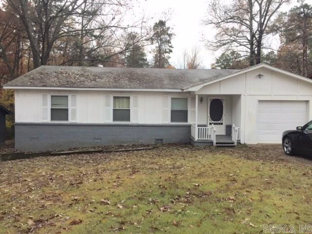 Great Buy! Roof replaced in 2013. New carpet and new paint in living/dining room. Air conditioner replaced in 2013. Motion lights and alarm system.  House sold as is.  Seller Motivated to sell!  Agents, alarm code required!