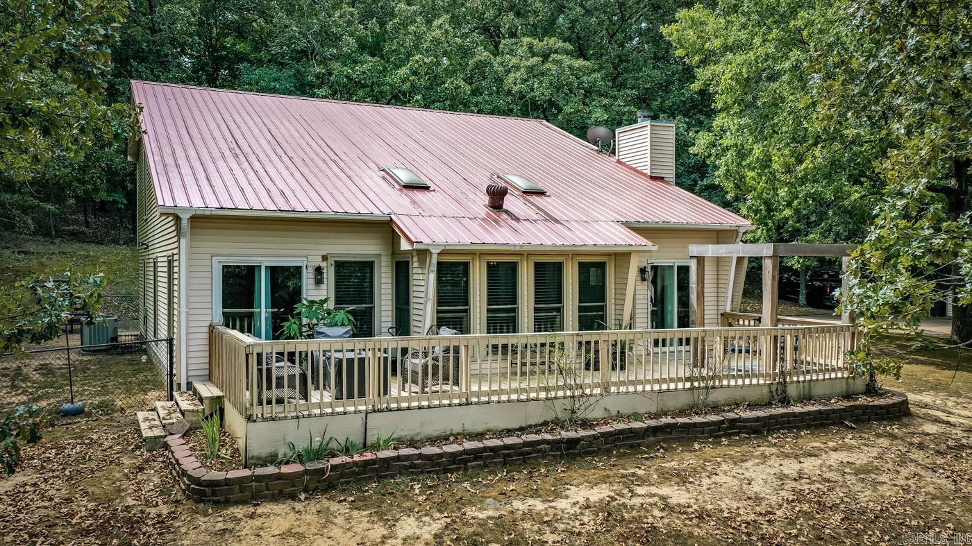 Absolutely Gorgeous Home on 9.08 Acres IN CITY LIMITS! Custom built, Move In ready, 4 bed, 3 bath home tucked back in your own private wooded oasis. There is so much room for all your needs with 16' ceilings, an updated kitchen with granite countertops, an inviting sunroom, a formal living room/formal dining, extra space for office, pond and gardening spots, and front deck that makes you feel like you are in the treetops. This home is a must-see. House is on City Water. Plenty of storage for your toys and hobbies with multiple storage buildings onsite! Extra Water source outside- Well Water for Gardening and yard play.  Don't miss out on seeing this unique home! Seller will entertain offers!