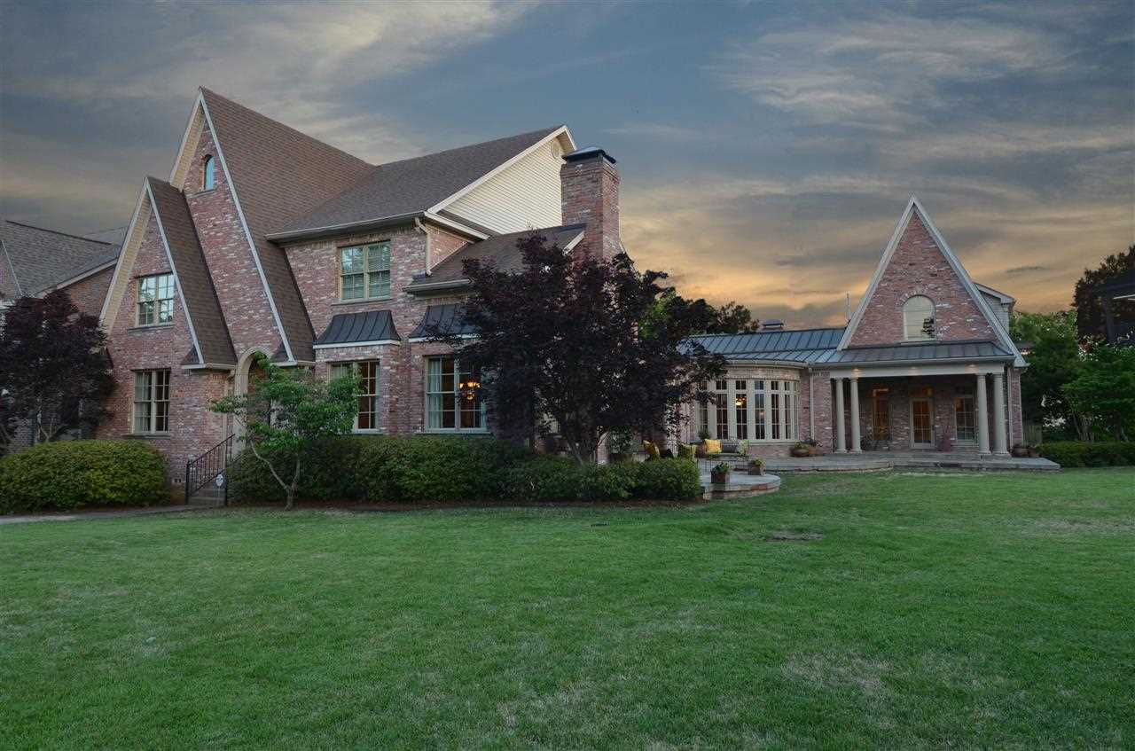 European Style home offers an Elegant Air! Enjoy TWO Master Suites on Main level. 4 Bedrooms up!  Banquet size Dining Room w/ imported Limestone fireplace.  Two separate living areas.  Media Room w/ theater seating & all equipment convey.  Artist studio w/sink & built ins.  Covered back Patio w/ 3rd fireplace.  Situated on .40 acres(3 lots), this home is ready for a growing family, but can live as One Level.  Custom built; professionally decorated.