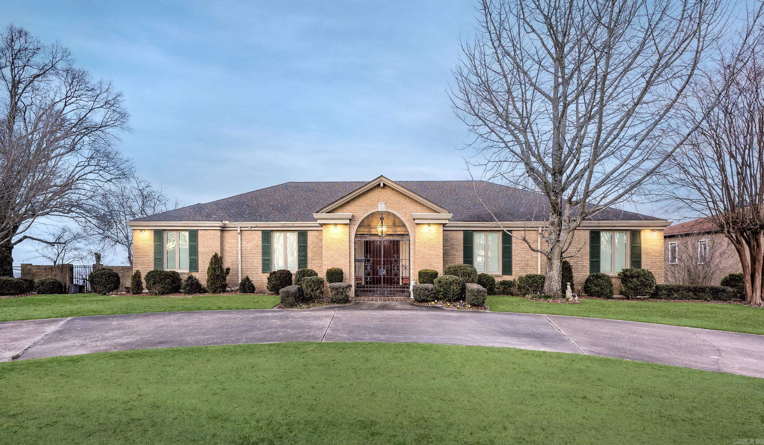 Experience luxury living at 13100 Rivercrest Drive, a prestigious home with breathtaking panoramic views of the Arkansas River. Built with unparalleled craftsmanship, this 6,234 sq. ft. estate offers 3 expansive living areas, 4 oversized bedrooms, and an office that doubles as a 5th bedroom. The chef's kitchen features a Sub-Zero refrigerator, while a second kitchen on the lower level adds convenience for entertaining.  The home's outdoor living spaces are simply stunning, with multiple terraces overlooking the river, a beautiful pool, and a walk-out lower level designed for relaxation. Inside, custom millwork and abundant storage enhance the thoughtfully designed floor plan. A 4-car garage, circle drive, and a dedicated workshop/craft room add practicality to the luxury.  Built like a fortress, this exceptional home offers a rare opportunity to own one of Rivercrest's finest properties.  Schedule your private showing today.   (See Agent Remarks)