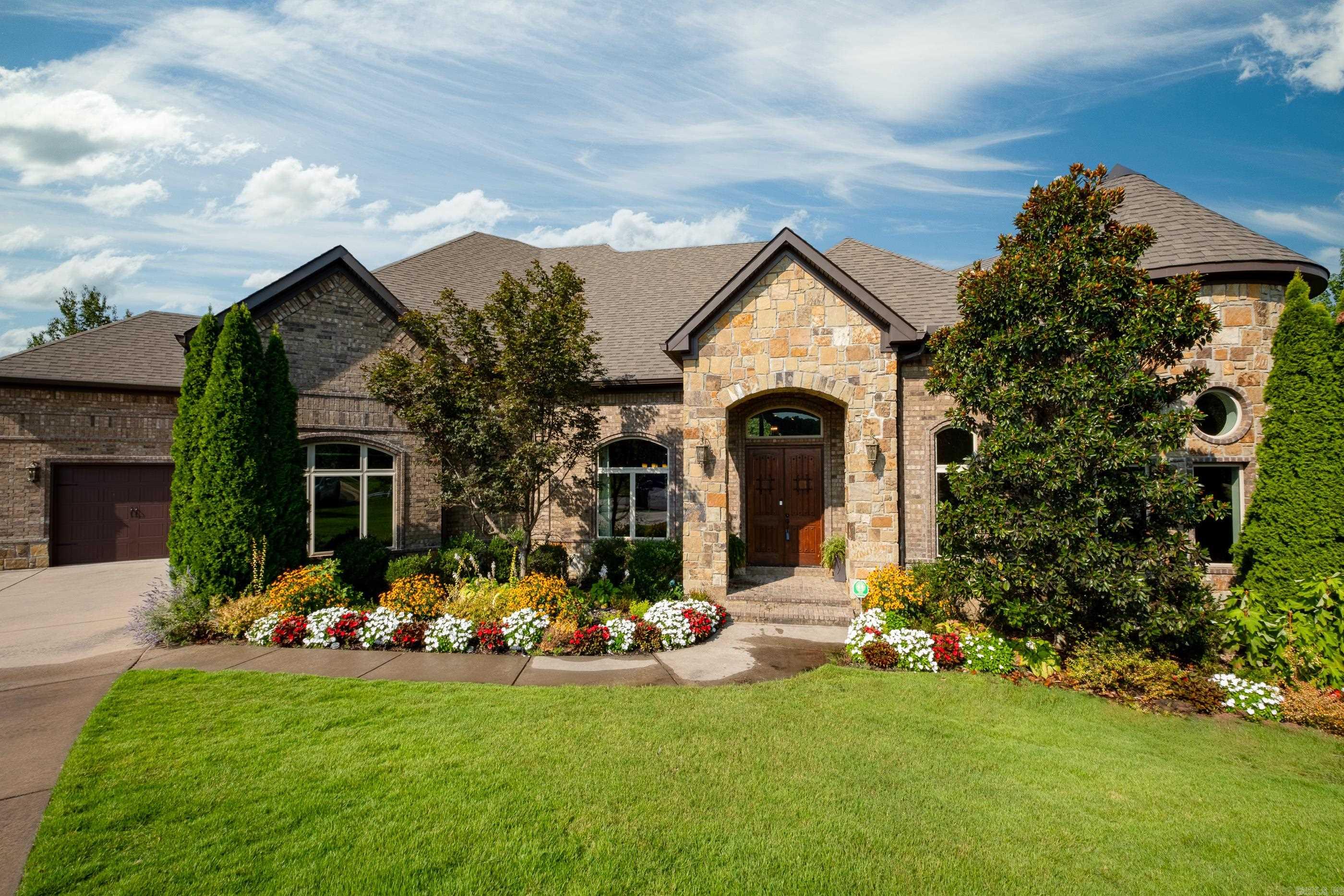This one has it all!  Custom built with every detail in mind!  Three car side load garage, covered front porch and double back deck overlooking greenspace and walking trails located on a private cul de sac.  Handscraped hardwoods, butlers pantry, cubbies, laundry chute and additional landscaping.  Office with built ins, eat in kitchen with island, dining room, wet bar, laundry room with sink, theater room with reclining seating and downstairs bonus room with full bar and bathroom.  Allo bedrooms have their own bathroom, master bath has walk through steam shower and full additional washer/dryer in master closet.  A MUST SEE! See agent remarks.