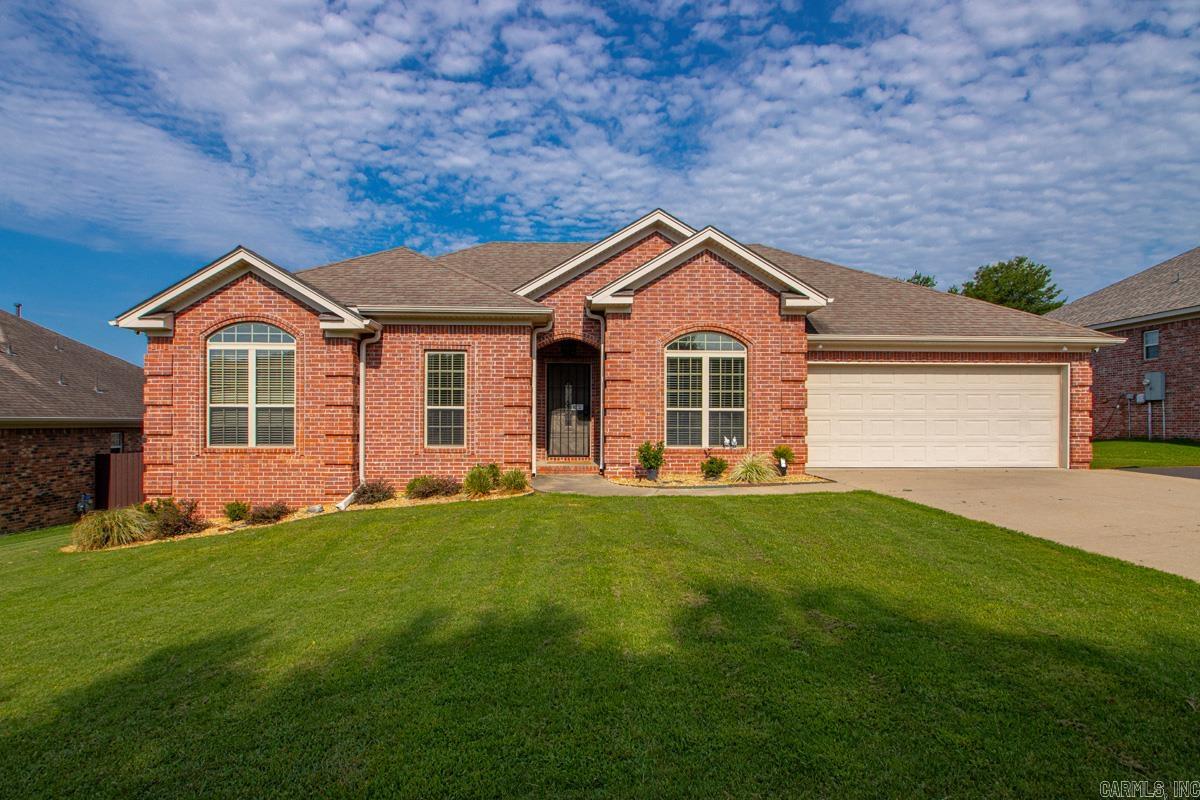 Welcome to your conveniently located and move in ready next home! Step inside this beautiful brick home and be greeted by a bank of windows on the living room wall that overlooks you near quarter acre lot. To the right is a spacious formal dining room that could also function as an office. The kitchen has a breakfast nook, granite countertops, and plenty of cabinets and pantry. A dedicated laundry room with storage is off of the kitchen. The primary suite is spacious, with wonderful natural light, a spacious walk in closet, and bathroom with jacuzzi tub plus shower. On the other side of the home, this split plan provides three additional spacious bedrooms and a full bathroom. Outside you can enjoy your covered patio and lush green landscape. Storage building in the rear yard conveys. Seller to replace primary suite carpet with acceptable offer. One year home warranty to be paid by seller as well.