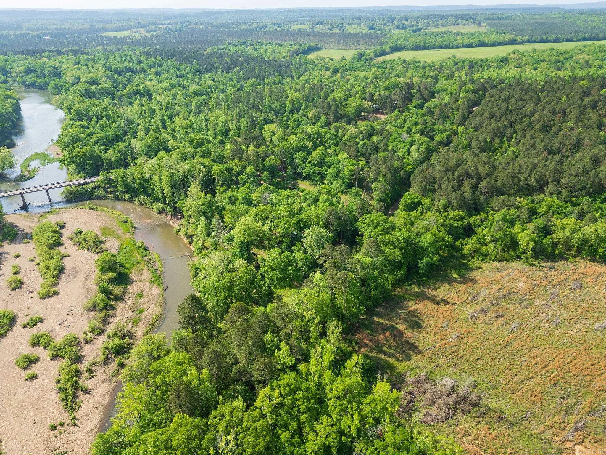Caddo River Property! Gated 3.72 acres +/- on the Caddo River in Amity, Ar. (Clark County Ar.) right off Hwy 84E  Seller has done all the hard work! There is electricity, water, and septic system already in place. Seller also has a partially built conaire home two story, that you could finish as you like!. Property goes to the middle of river. You can fish and enjoy this great lifestyle everyday, not just vacation! Also, if you like to float, just take your canoe and put in on Hwy 182 and float down to your home and take out!  "Life is Good!"